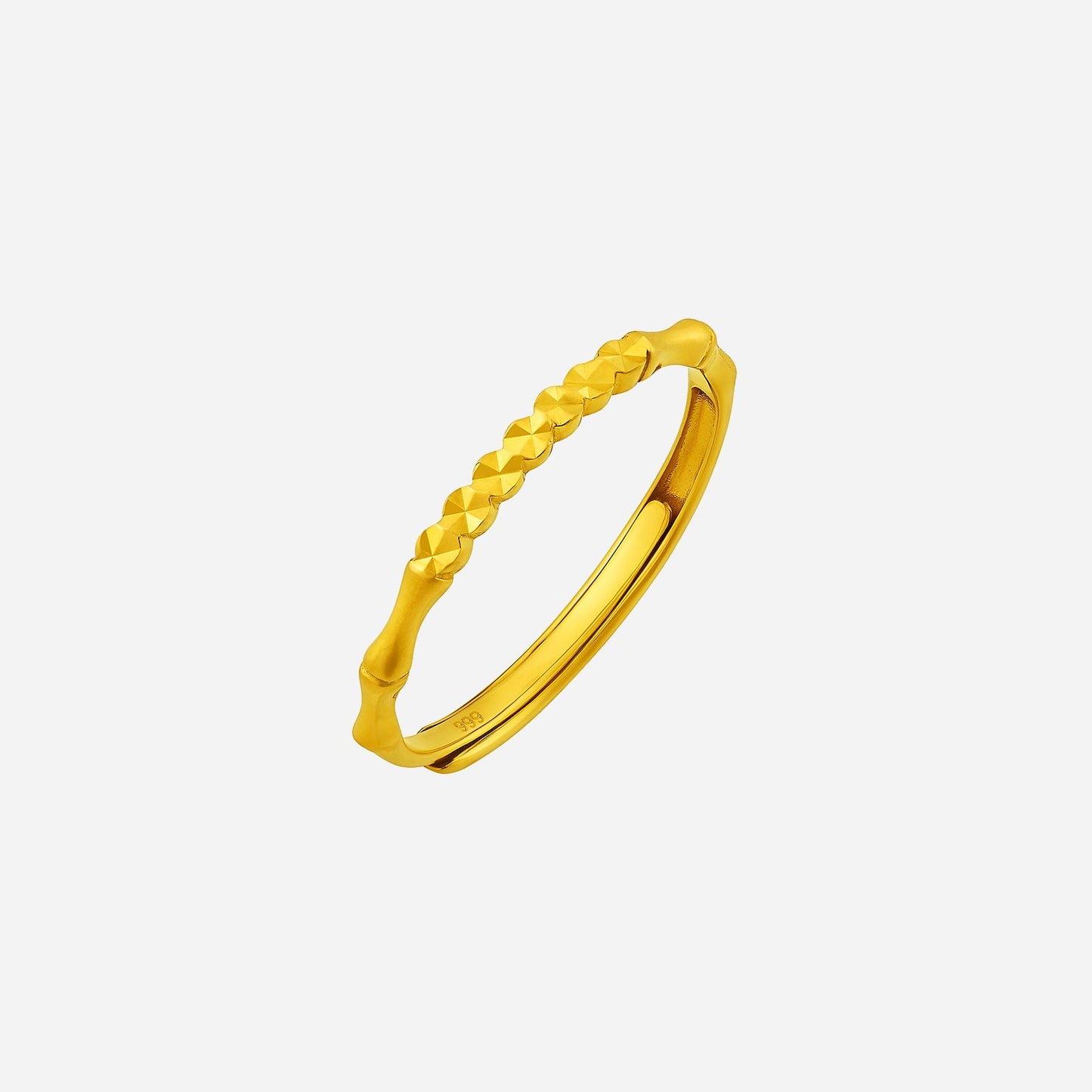 24k yellow gold ring with bamboo-inspired textured design, featuring elegant, smooth edges for a sophisticated look.