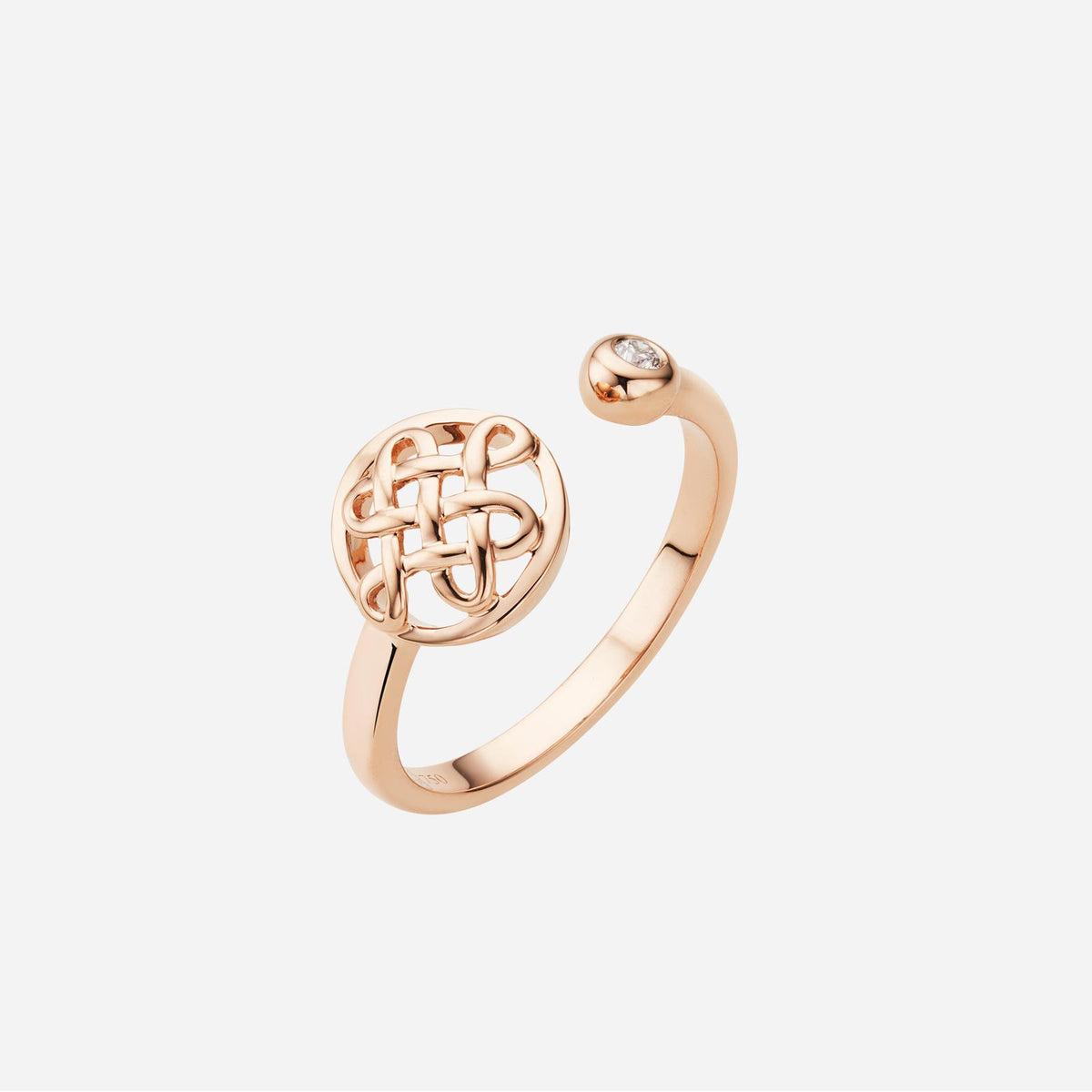 eternity knot diamond ring in 18k rose gold with a round diamond and intricate knot design. stylish open band.