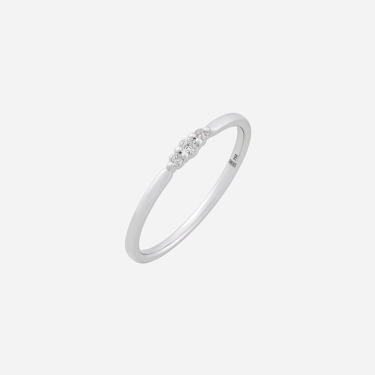 slender spark diamond ring in 18k white gold with a slim band and three subtle diamond accents.