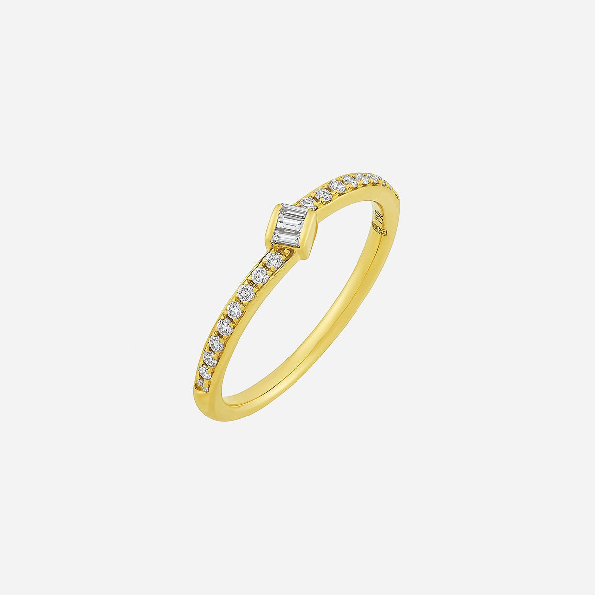 dainty 18k yellow gold ring with baguette diamond and sparkling round diamonds along the band.