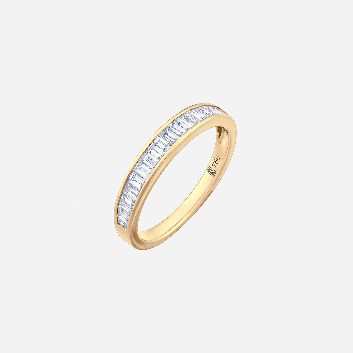 linear baguette diamond ring in 18k yellow gold with a seamless row of sparkling baguette diamonds.