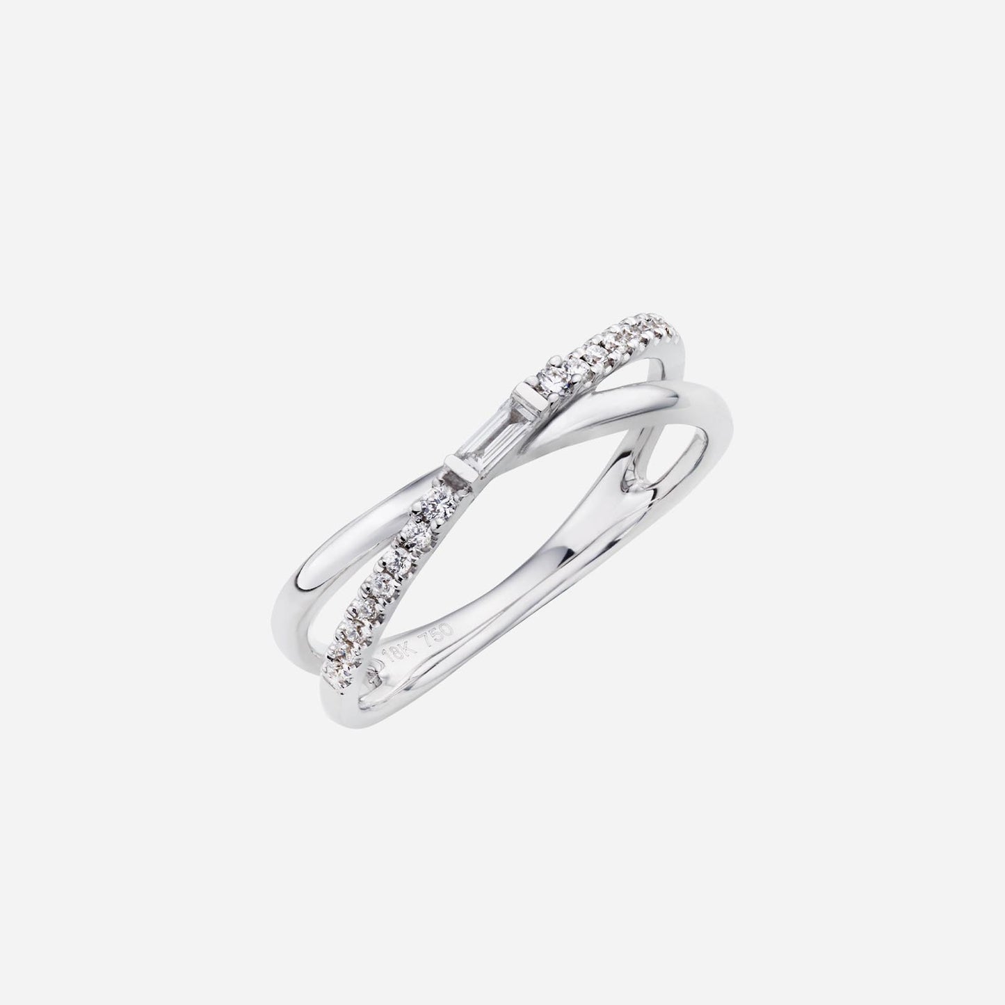 crossover baguette diamond ring in 18k white gold with smaller diamonds on each side, modern and elegant design.