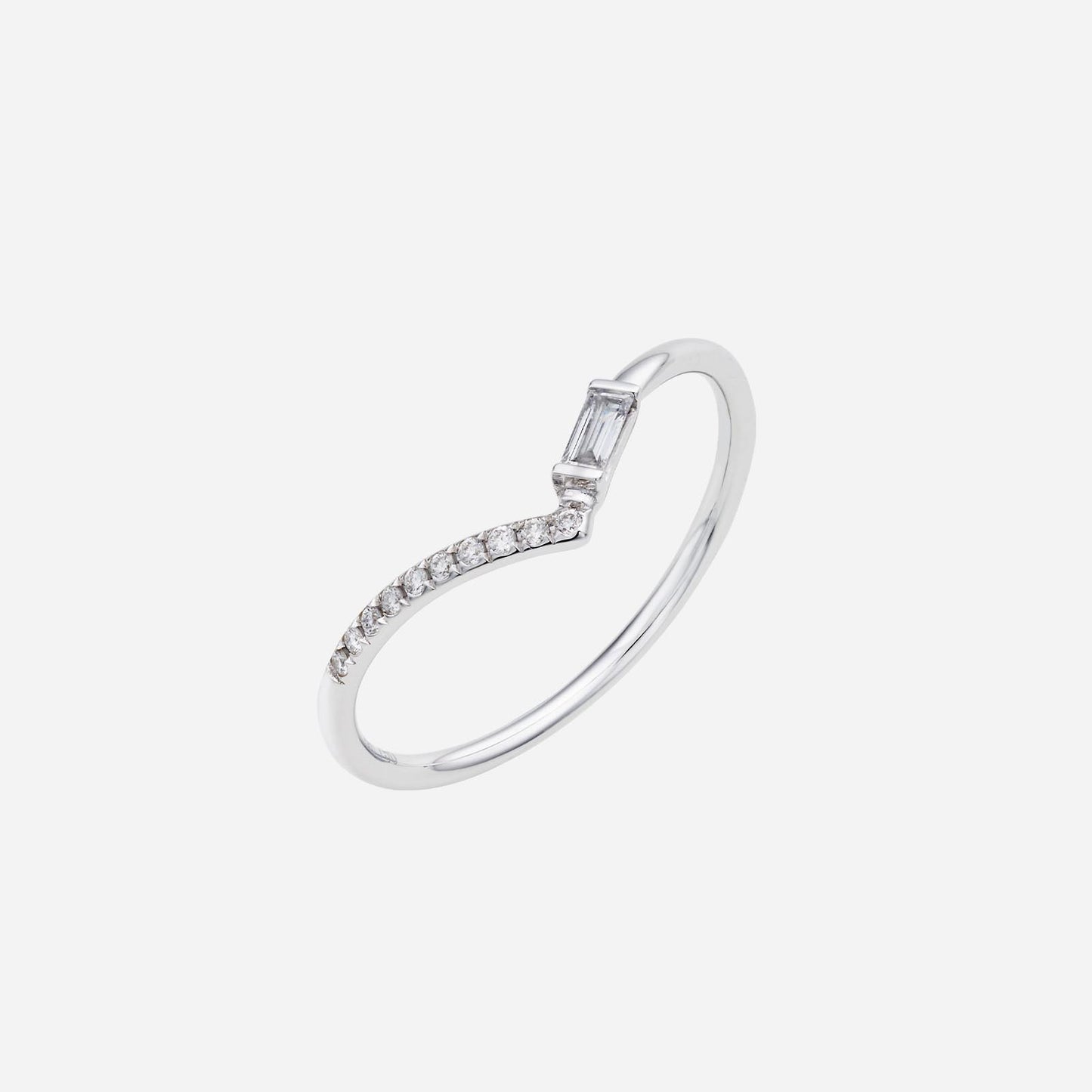 wishbone ring in 18k white gold featuring a mini baguette diamond and smaller shimmering diamonds in a curved design.