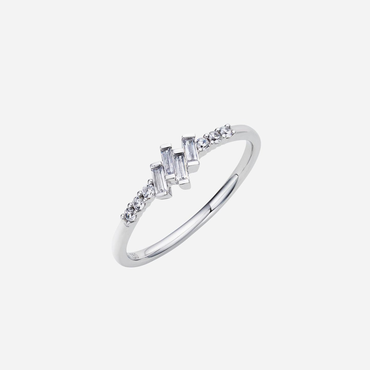 baguette diamond ring in 18k white gold with round diamond accents on each side. elegant wave design.