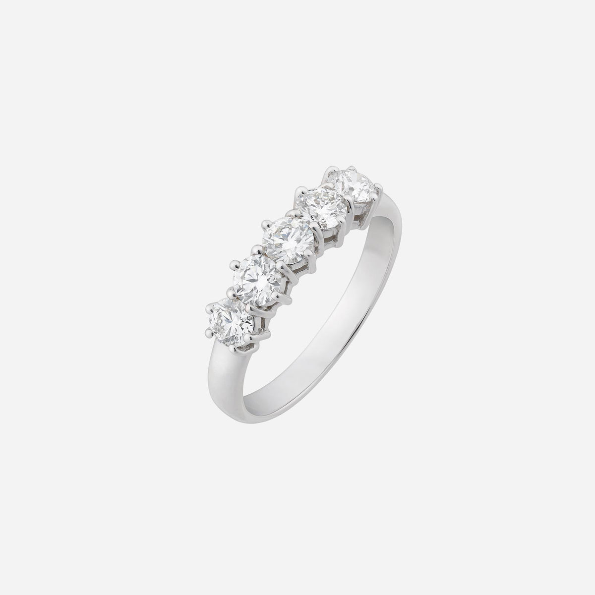 diamond band in 18k white gold featuring five round diamonds in a classic design, symbolizing elegance and love.