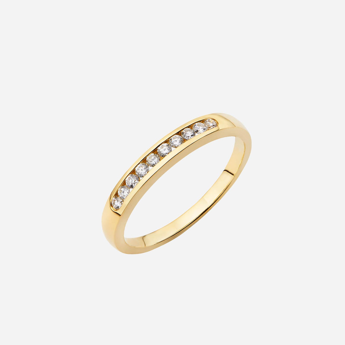 18k yellow gold band ring featuring channel set diamonds in a sleek, modern design. perfect for any occasion.