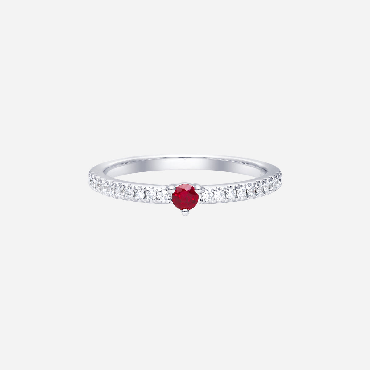 ruby and diamond ring in 18k white gold, featuring a round ruby center and a sparkling diamond band.