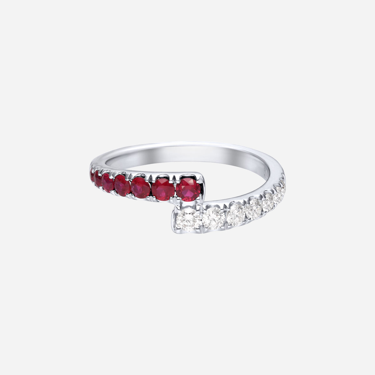 ruby and diamond ring in 18k white gold, featuring curved design with alternating red rubies and sparkling diamonds.