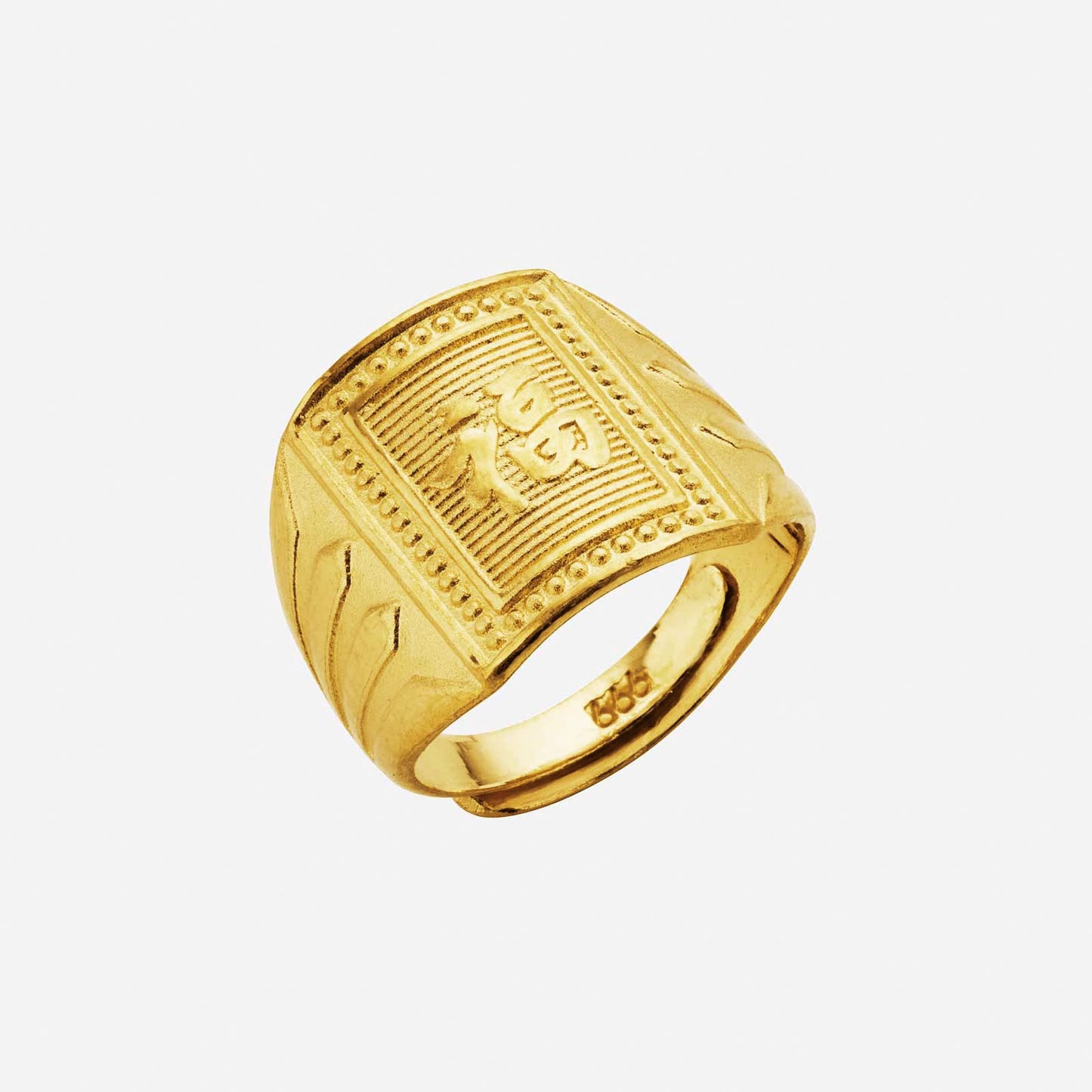 auspicious baby ring in 24k yellow gold with intricate engravings and playful symbols for love and protection.