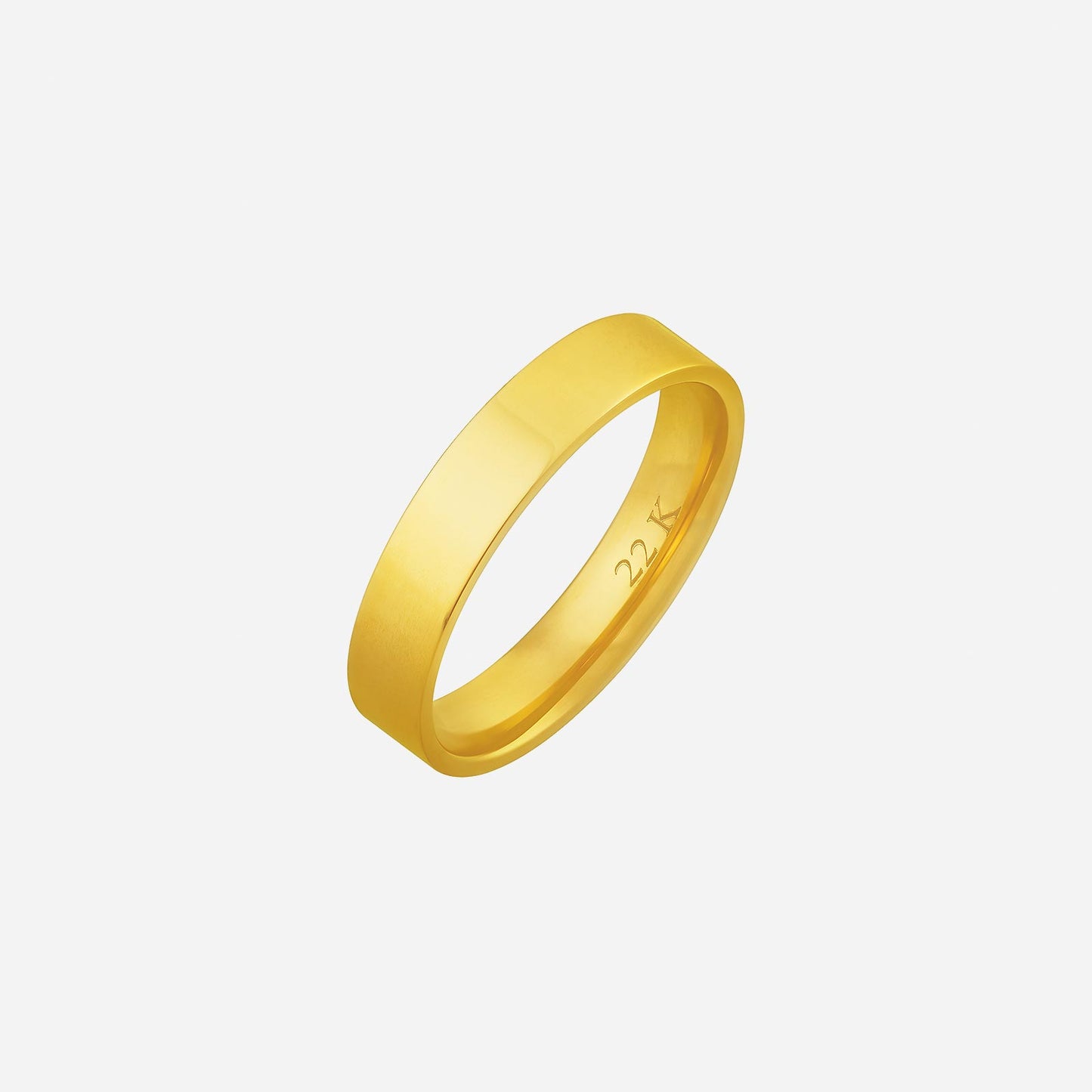 classic flat band wedding ring in 22k yellow gold with smooth finish and engraved interior.