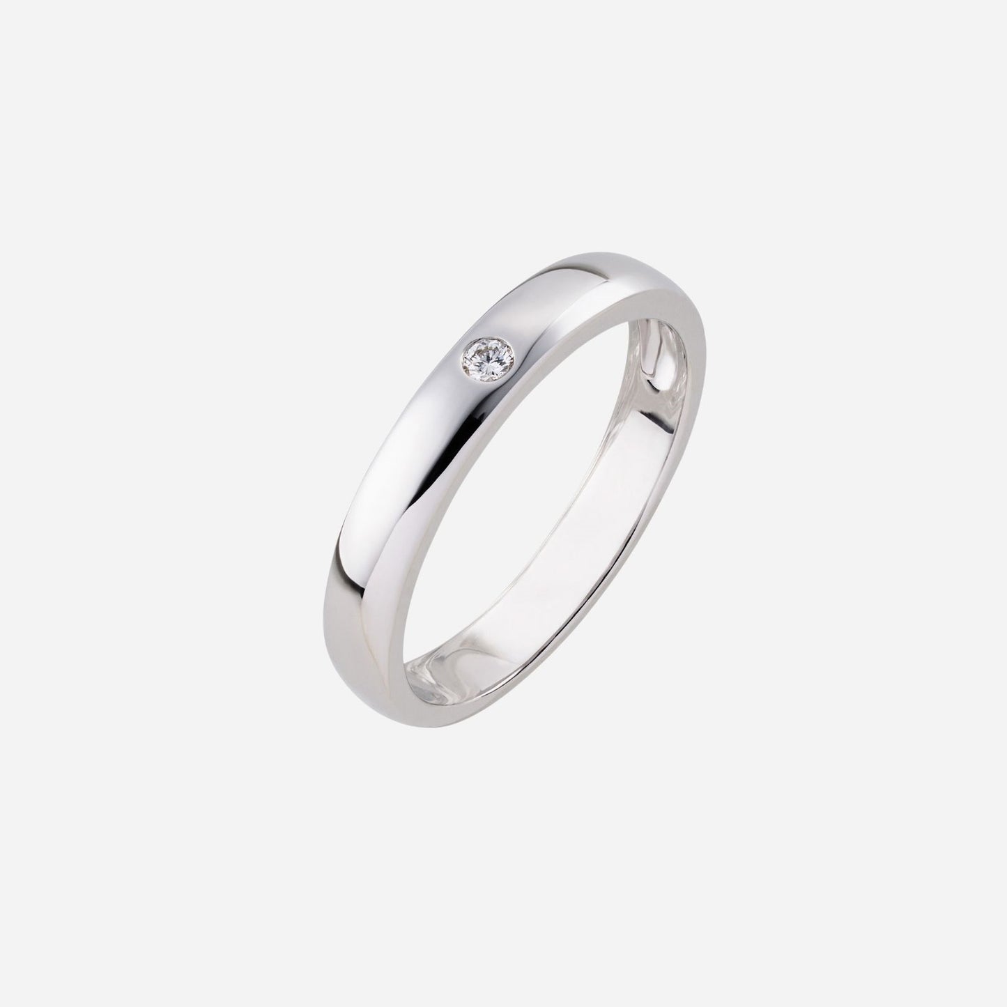 18k white gold adore wedding band featuring a single diamond, sleek polished design with a modern aesthetic.