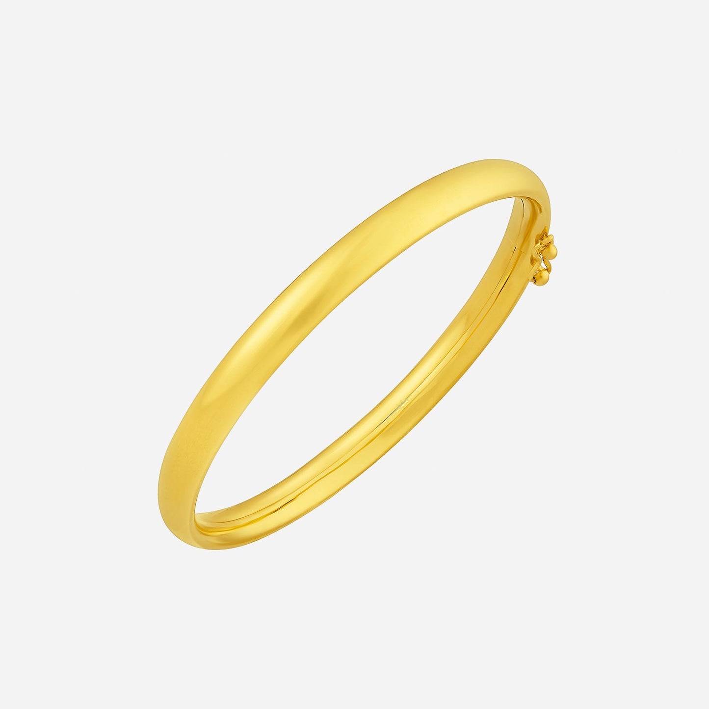 22k yellow gold dome bangle with a sleek, unadorned design highlighting its smooth, polished finish.
