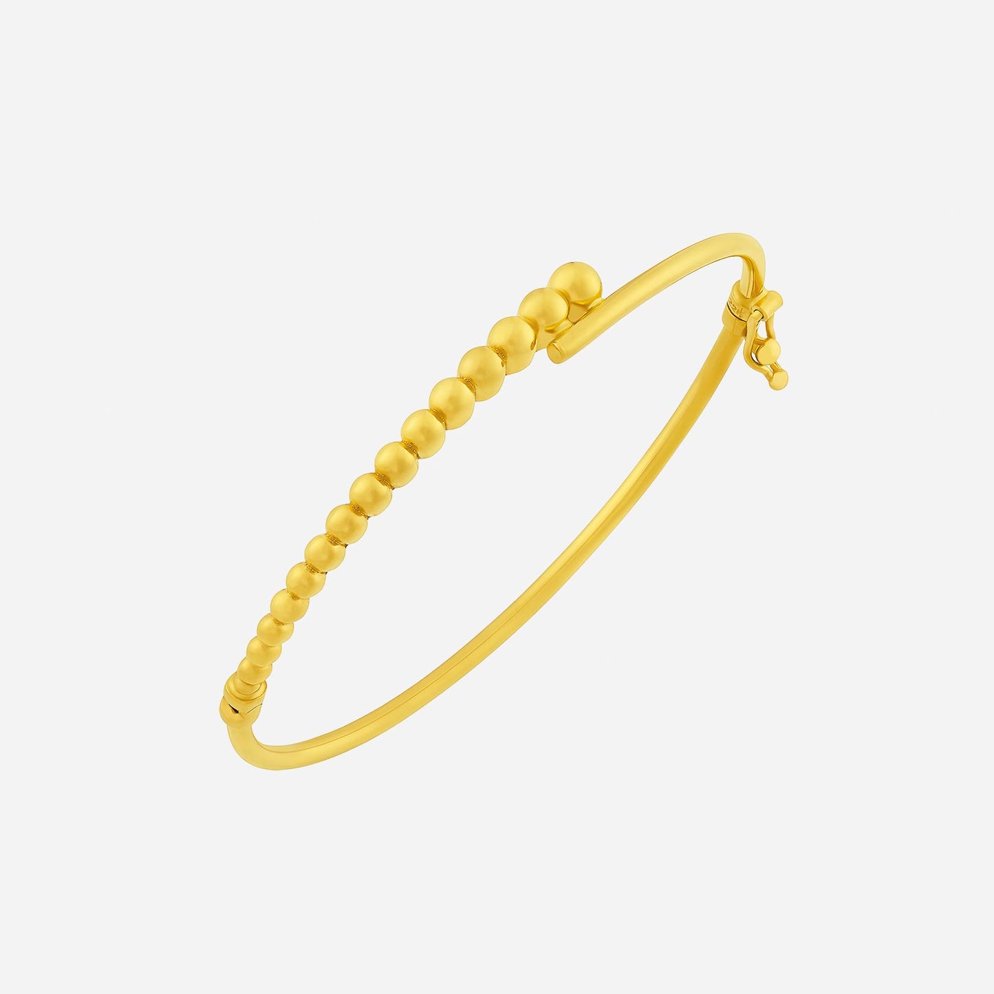 22k yellow gold bangle with a unique overlapping design and small spherical accents for added elegance.