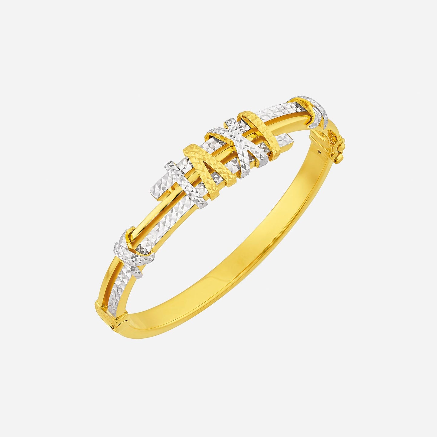 22k yellow and white gold bangle with intricate patterns and bold structure, showcasing a modern design.