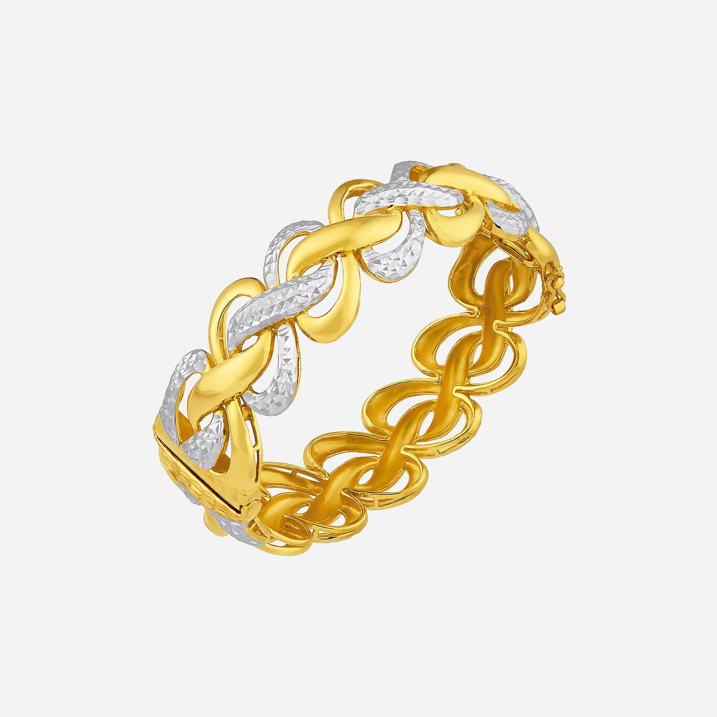 22k yellow and white gold bangle with bold intertwined loops, symbolizing interconnectedness and luxury.