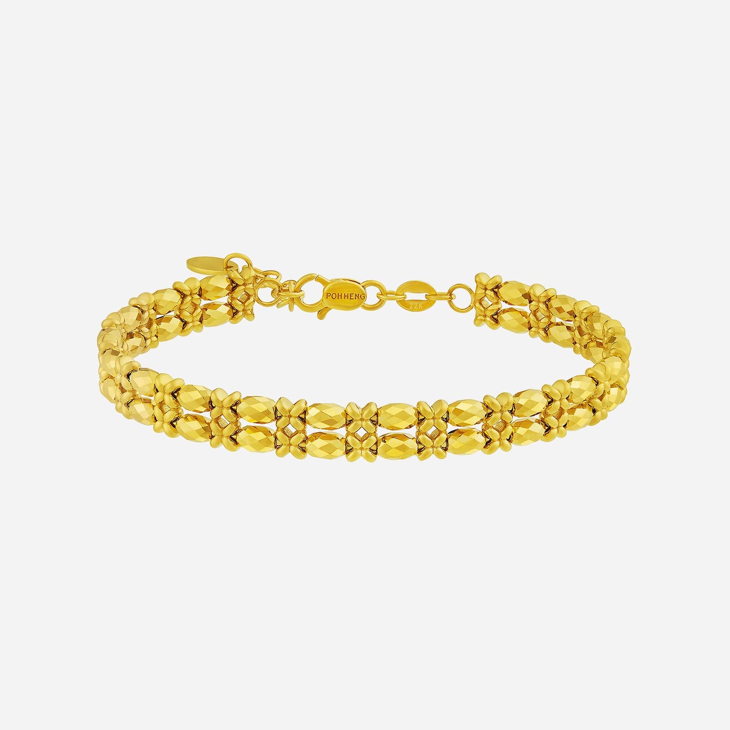 radiant bangle in 22k yellow gold with intricate design and faceted details, perfect for any occasion.