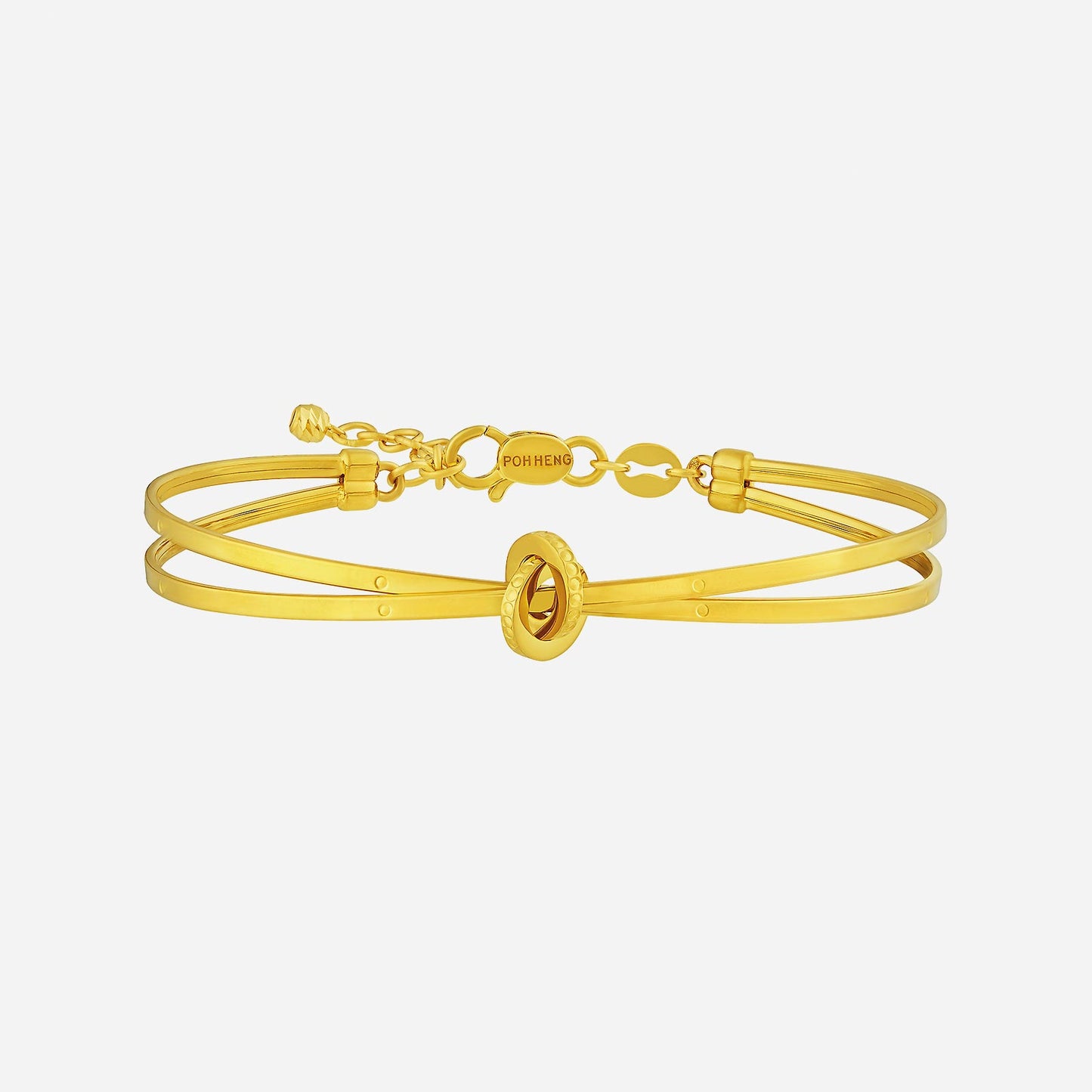 twisted bangle in 22k yellow gold featuring a sculptural center twist and twin clean-lined bangles.