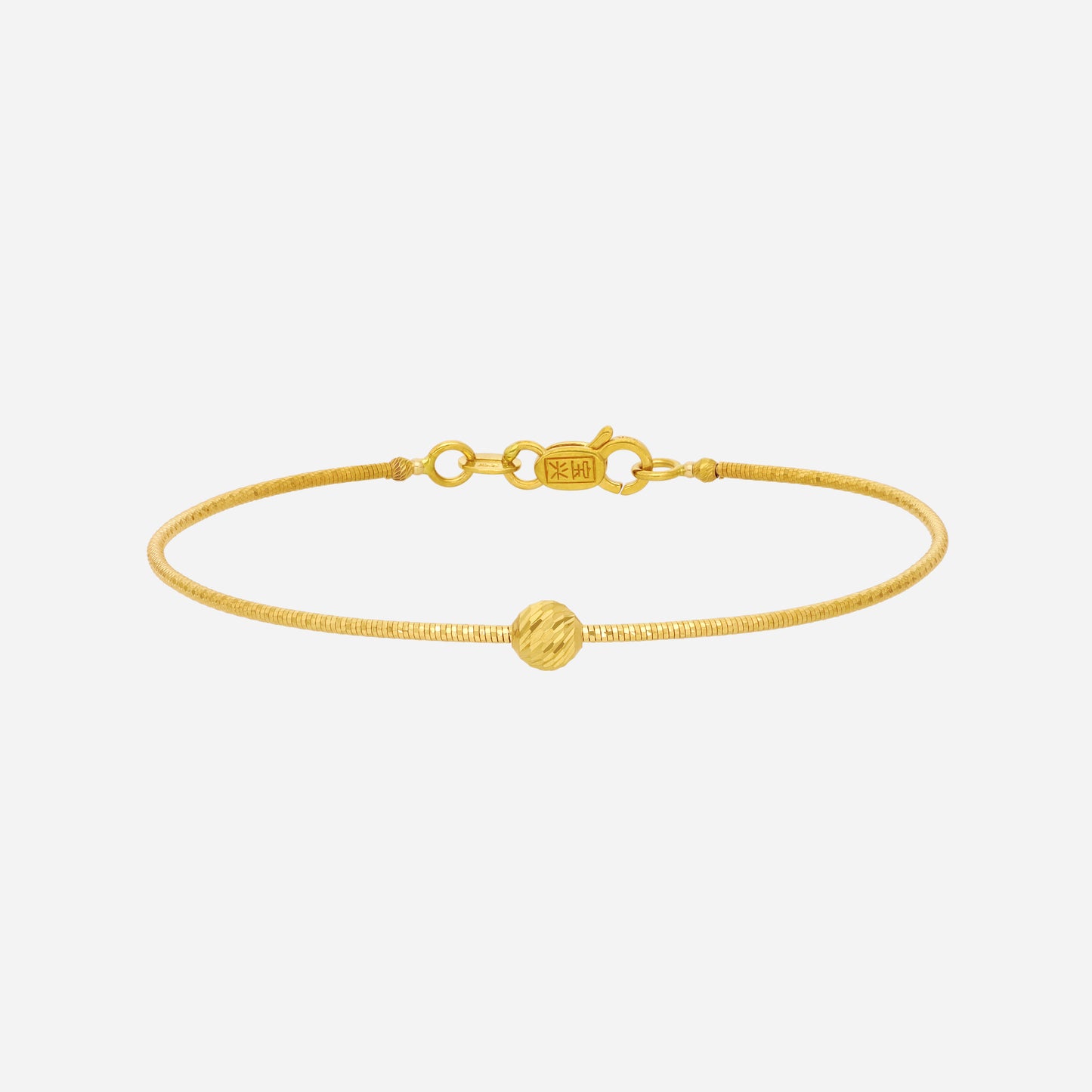timeless 22k yellow gold bangle with a textured finish and polished golden bead accent. perfect for daily wear.