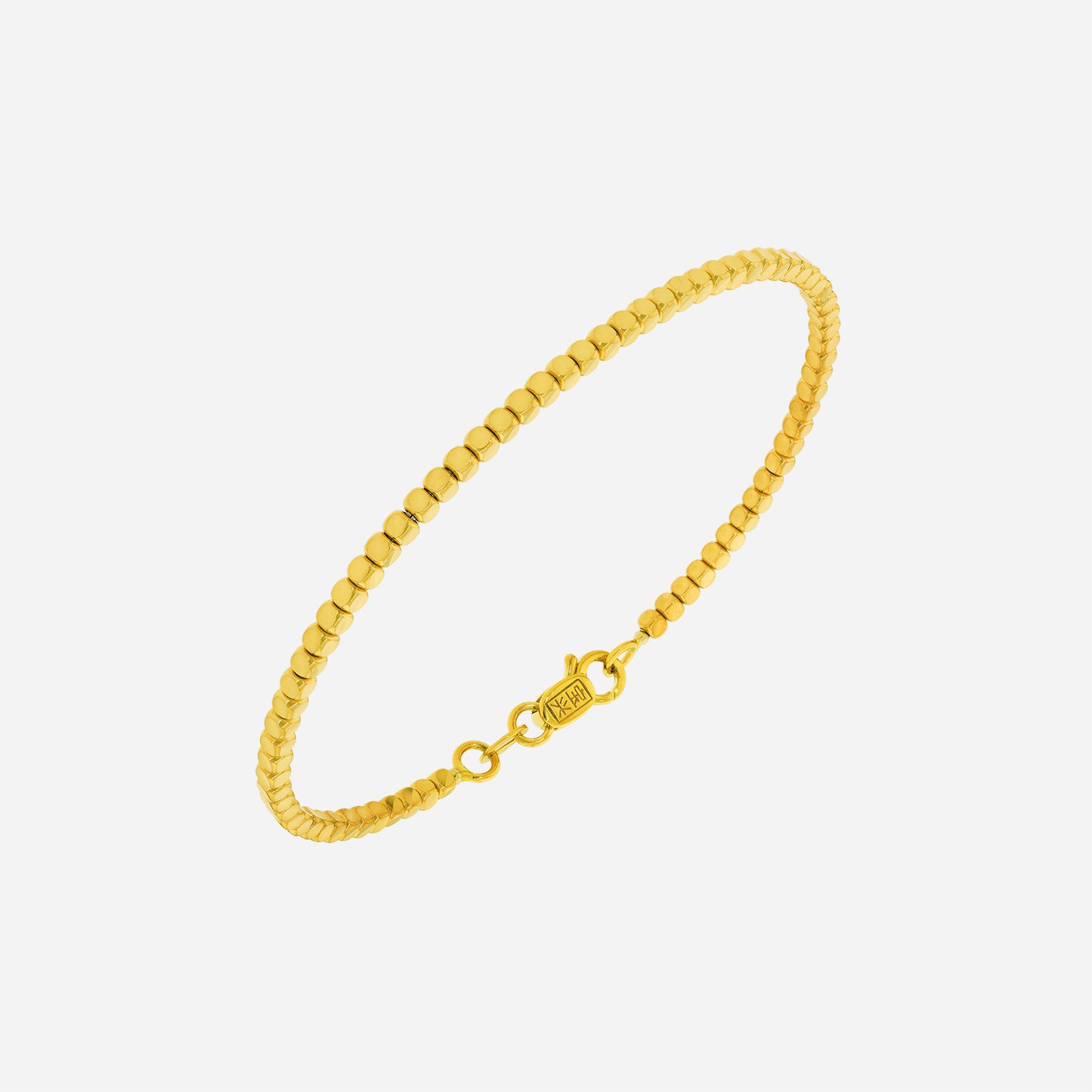 delicate yellow gold bangle with faceted beads, perfect for stacking or wearing alone for a stylish look.