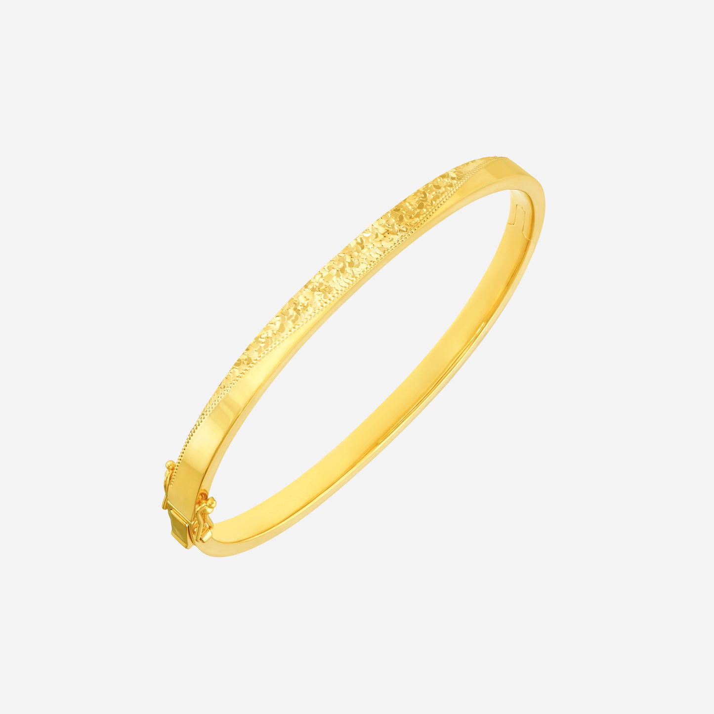 radiant bangle in 22k yellow gold with a textured design, elegantly encircling the wrist.