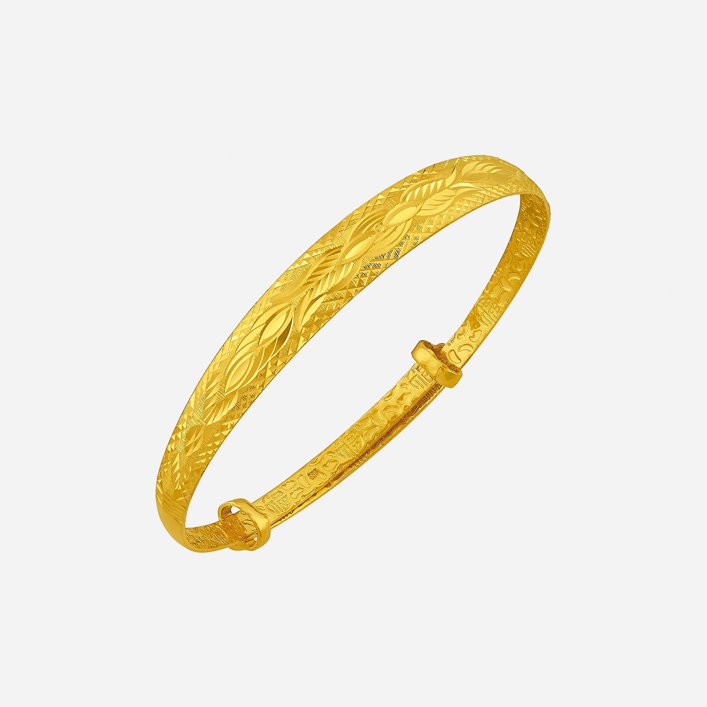 24k yellow gold bangle featuring an intricate design, perfect for adding sophistication to any outfit.
