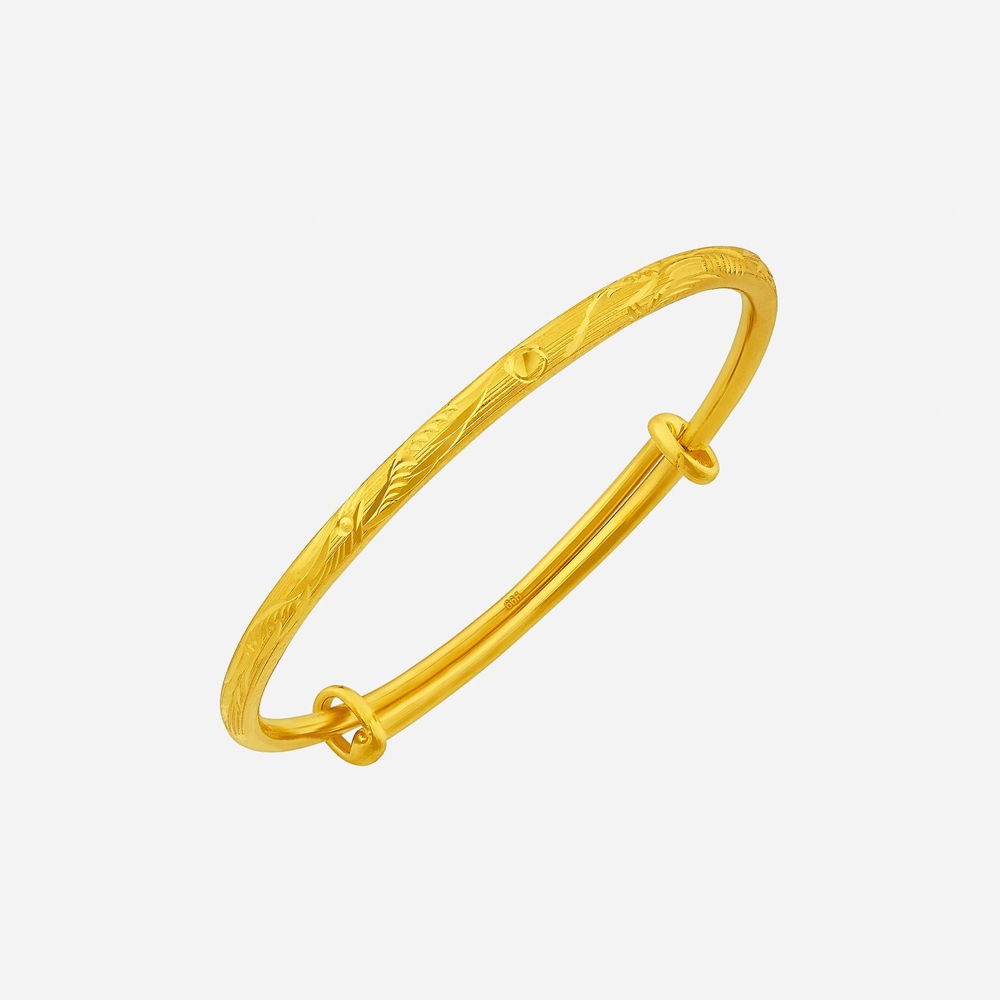 baby bangle crafted in 24k yellow gold with an elegant curved design and intricate engraving details.
