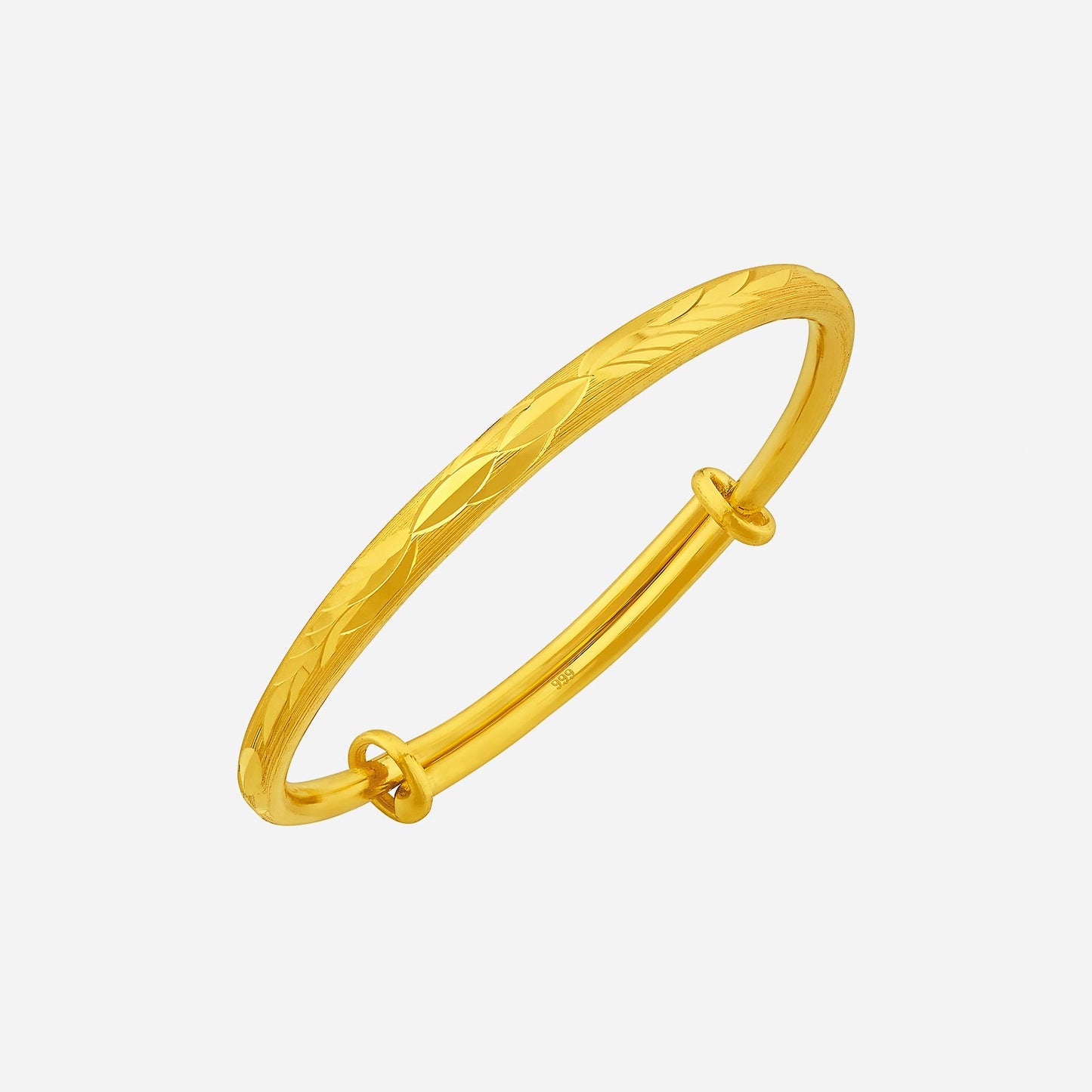 baby bangle crafted in 24k yellow gold with a delicate engraved design and smooth, curved edges for comfort.