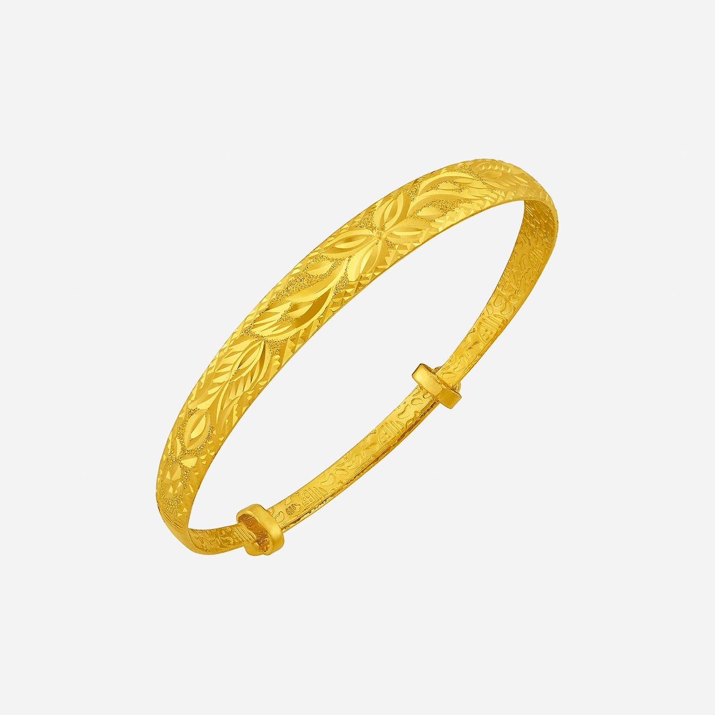24k yellow gold bangle with intricate floral engravings and refined design, perfect for any occasion.