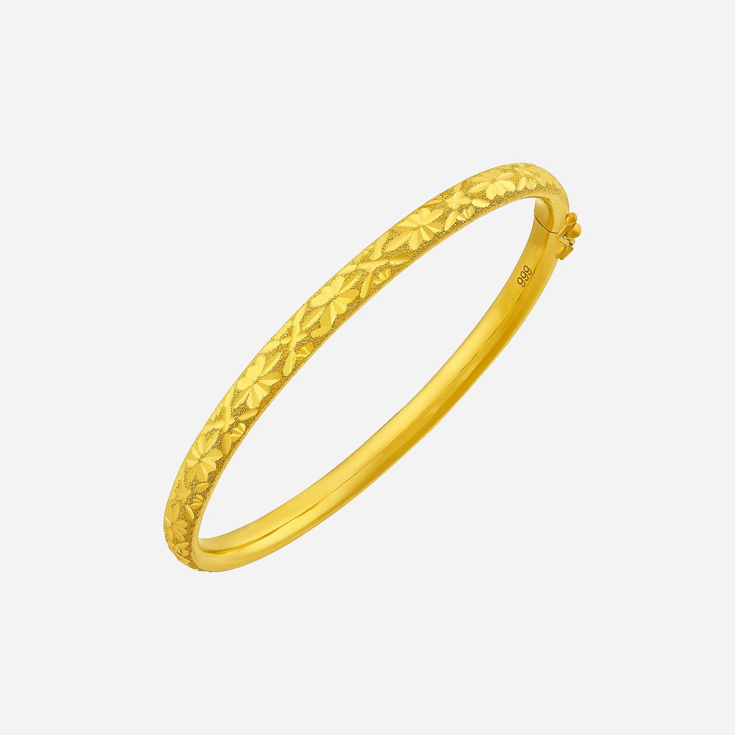 elegant yellow gold bangle, featuring intricate floral engravings for a touch of sophistication and luxury.