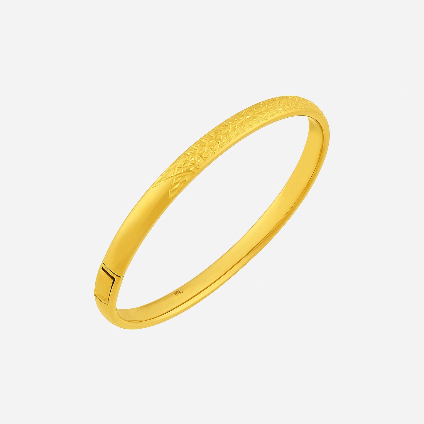 24k yellow gold radiant bangle with intricate texture, perfect for adding elegance to any outfit.
