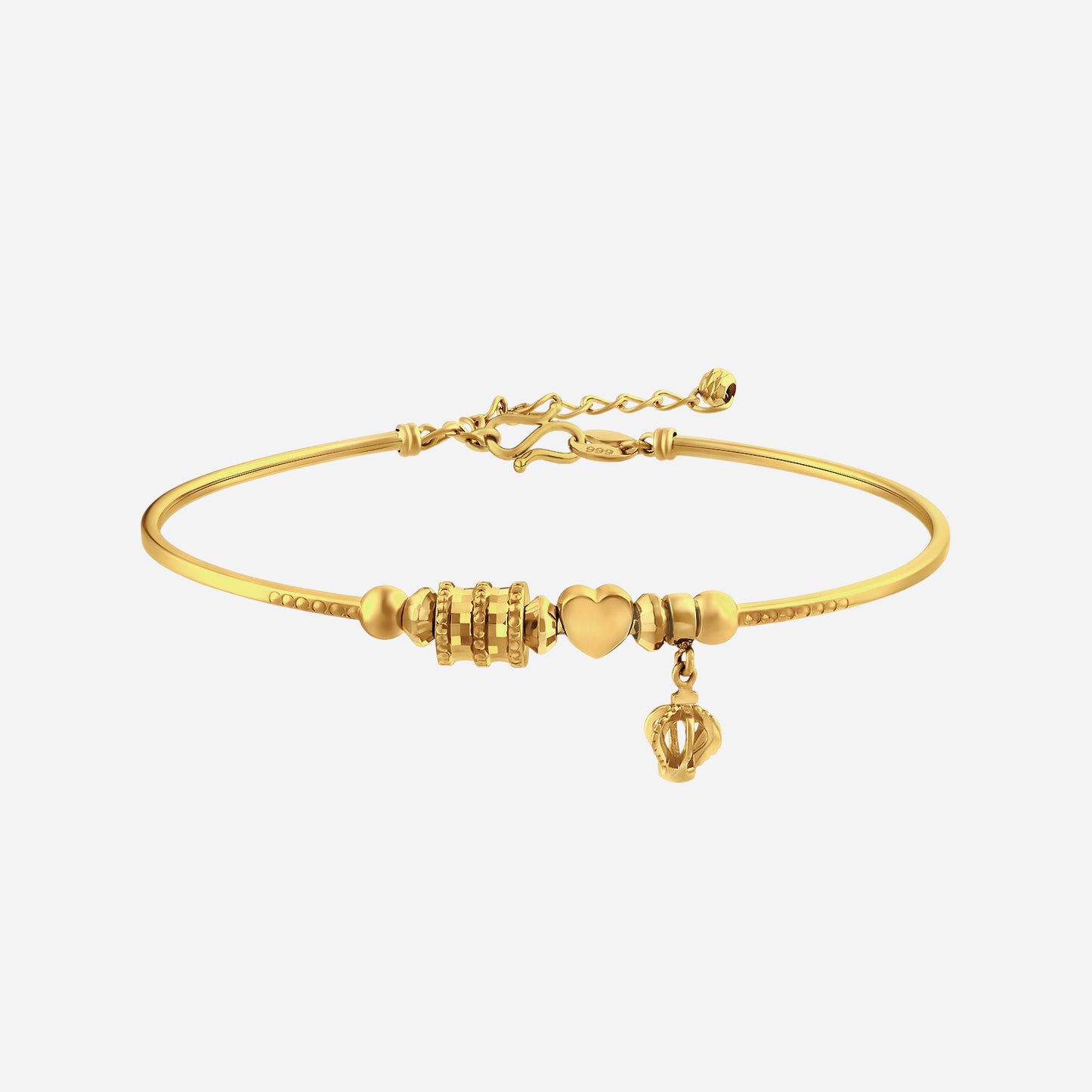 radiant bangle in 24k yellow gold featuring a heart charm and patterned beads for a timeless, elegant design.