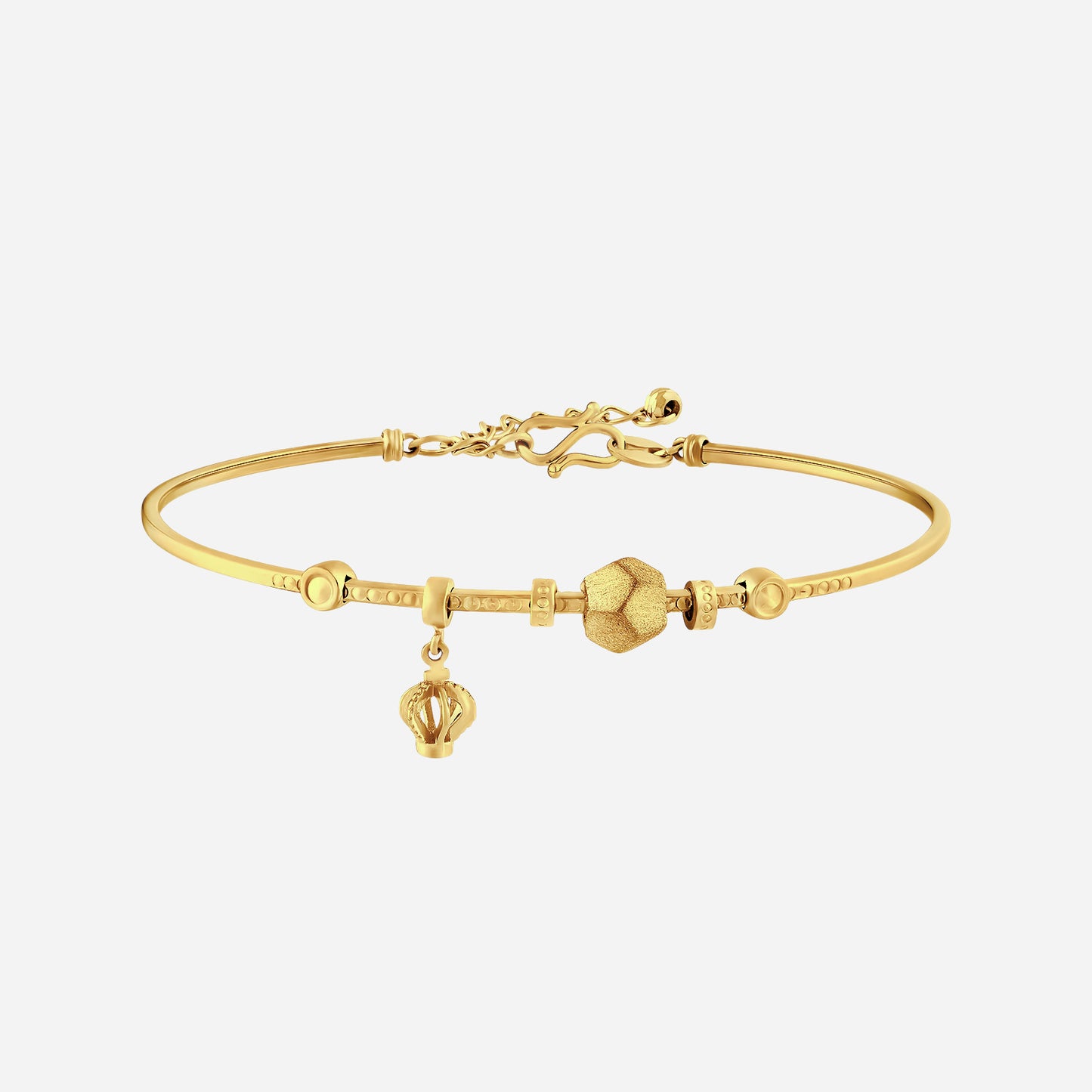 radiant bangle in 24k yellow gold featuring sculpted accents and delicate crown charm. perfect for elegant styling.