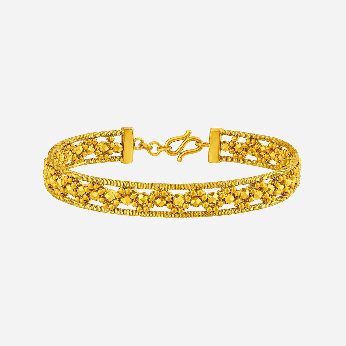 radiant bangle in 24k yellow gold featuring intricate openwork and polished bead accents for a luminous finish.