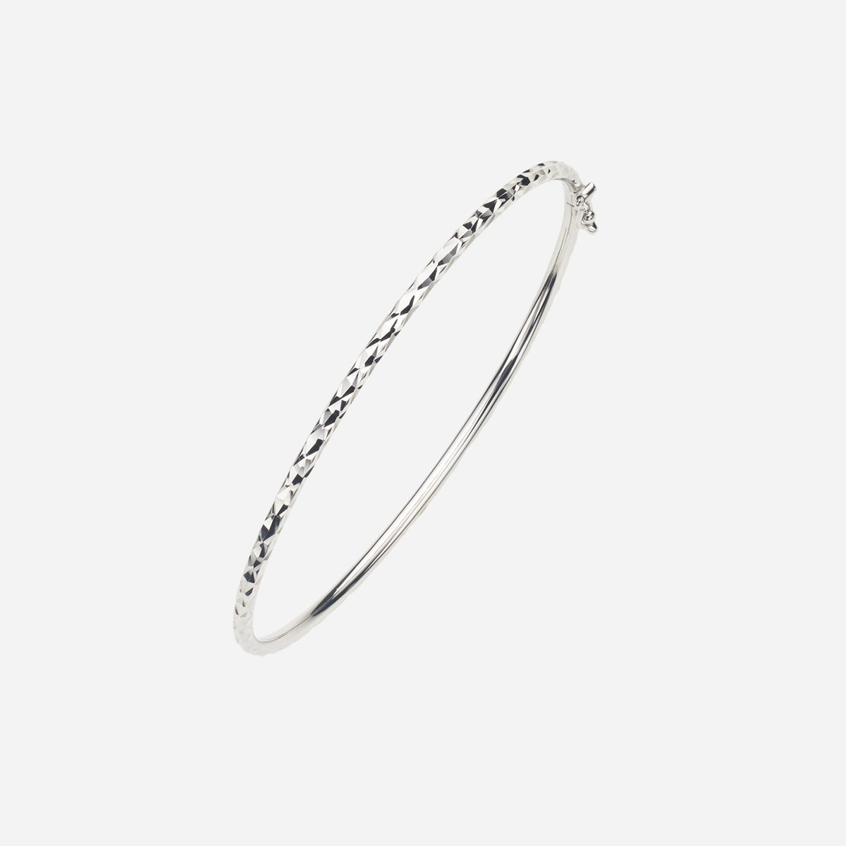 textured 18k white gold bangle with unique cuts, showcasing a modern and elegant design. perfect for any occasion.