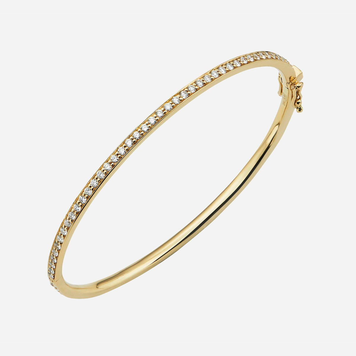 constellation bangle in 18k yellow gold, adorned with sparkling diamonds along the band. elegant and versatile design.