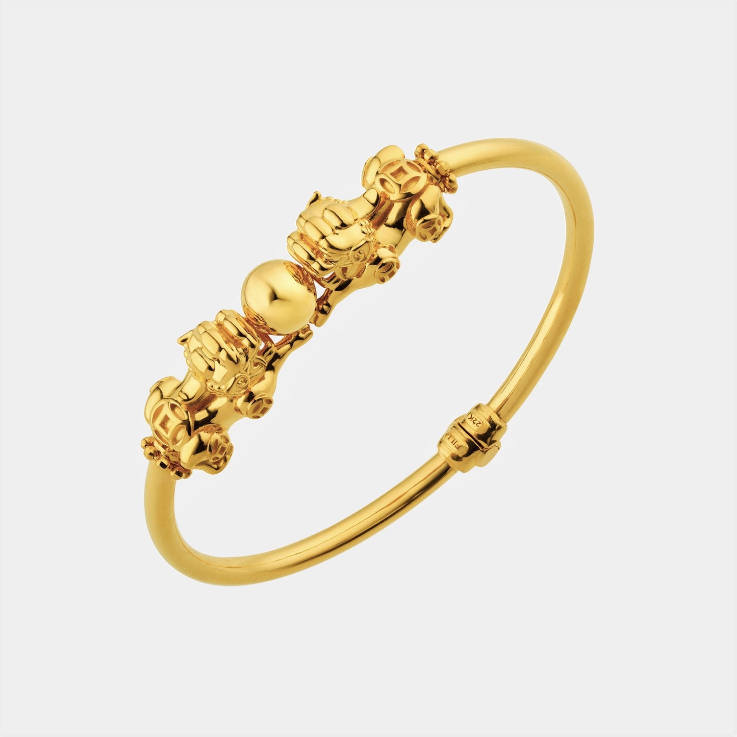 prosperity pixiu bangle in 22k yellow gold featuring playful pixiu motifs and a smooth, flexible design.