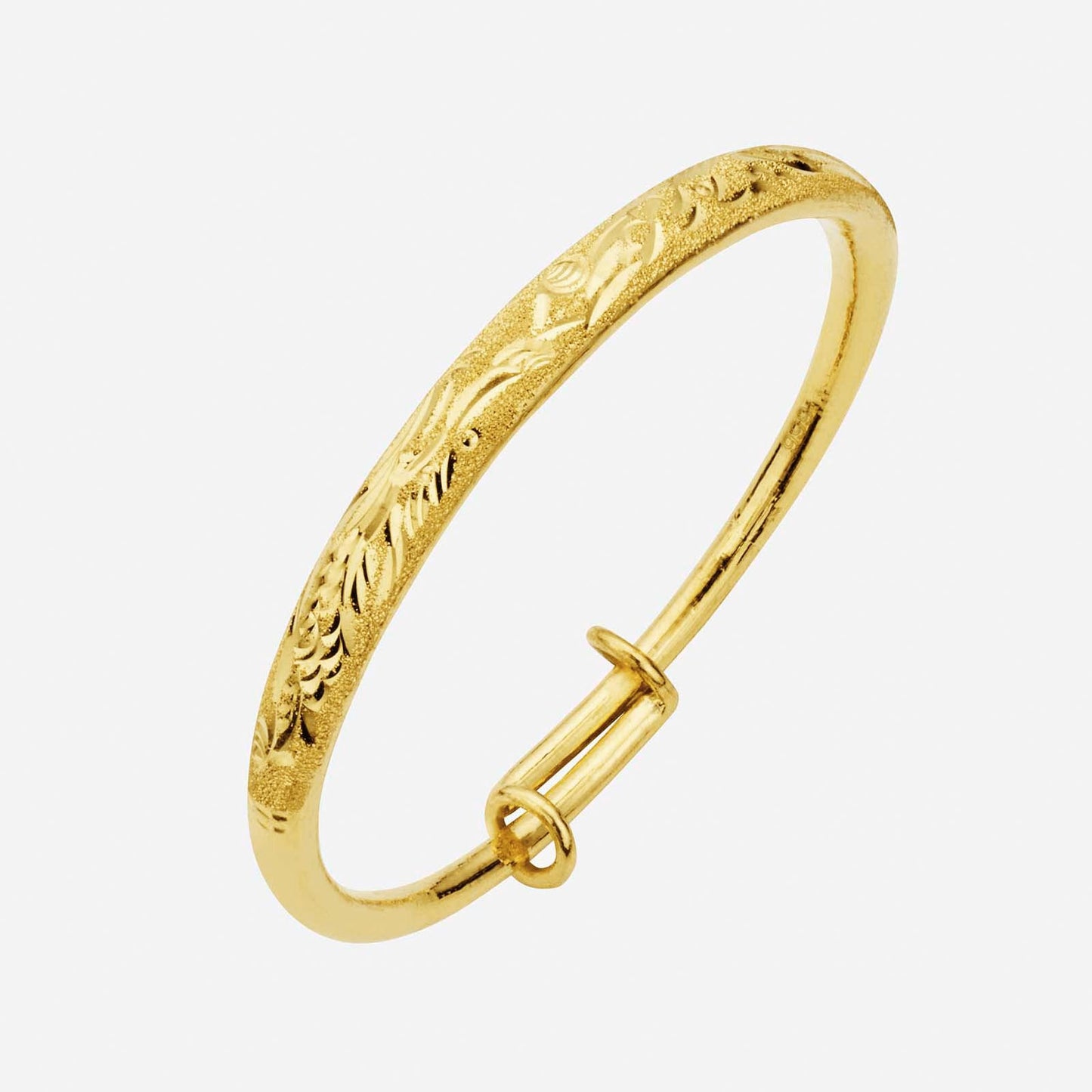 baby crafted bangle in 24k yellow gold with intricate dragon design and secure clasp closure.