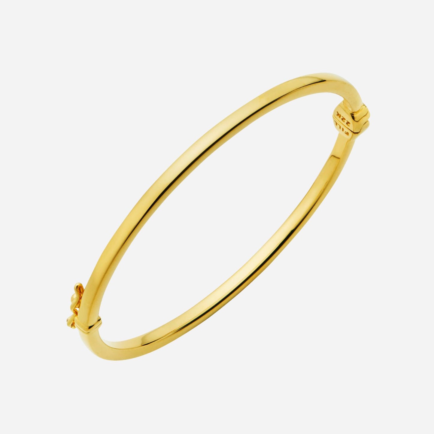flat bangle in 22k yellow gold featuring a bold, simple design with a clasp and hidden hinge.
