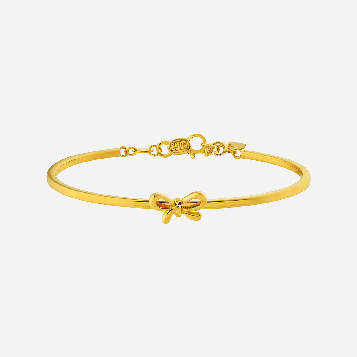 ribbon bangle in 22k yellow gold featuring a delicate bow design, perfect for gifting on any occasion.