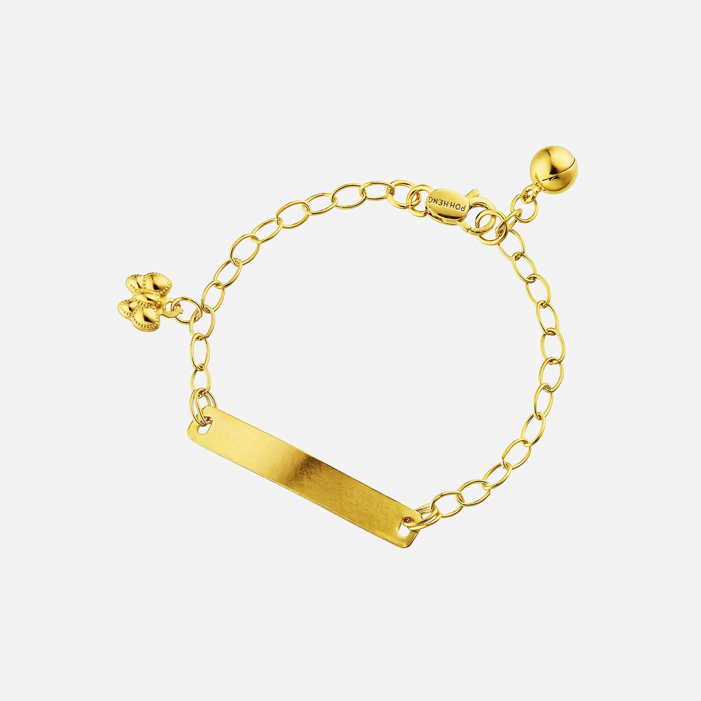 22k yellow gold baby name bracelet with customizable name plate, ribbon charm, and bell detail. perfect for little ones.