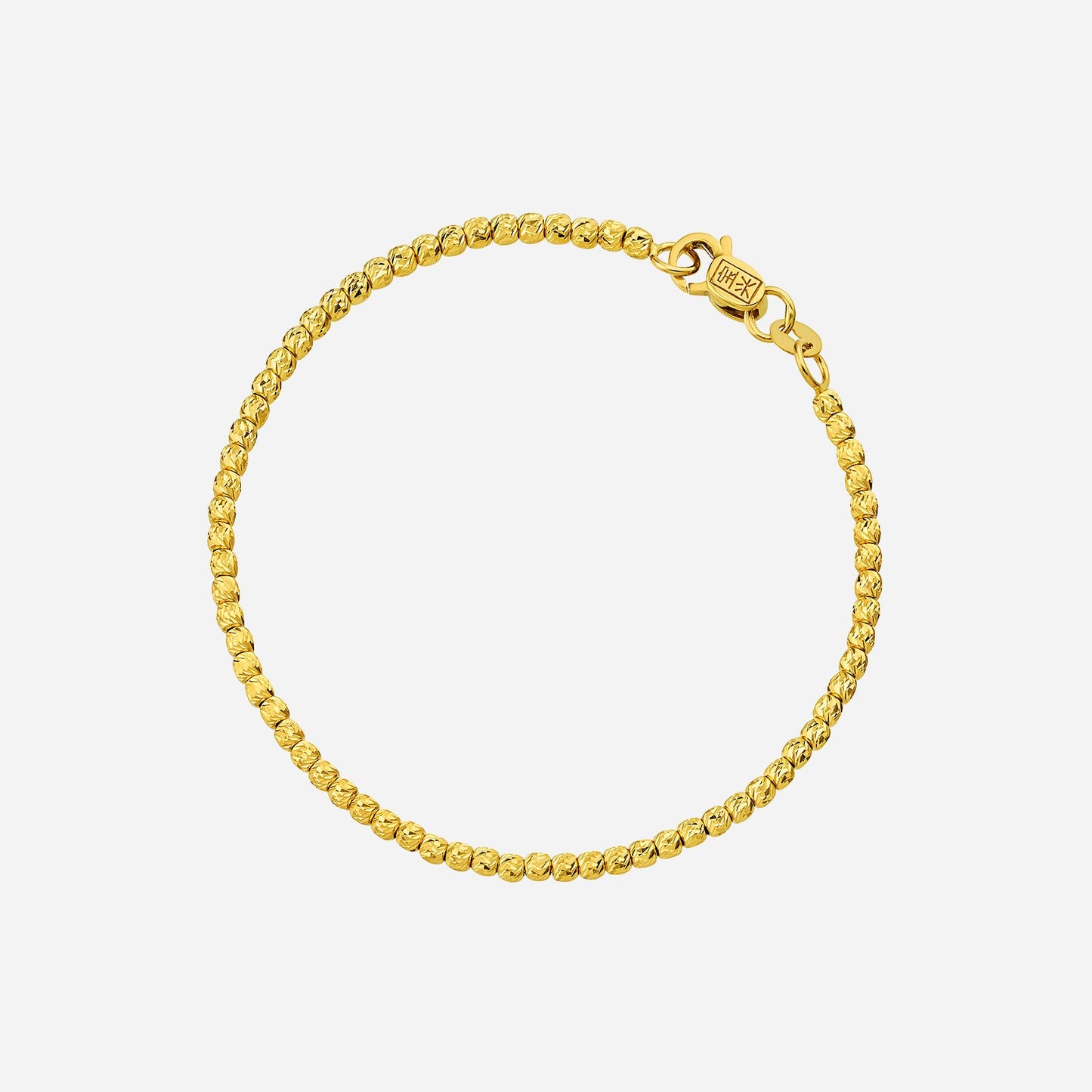 accent bead bracelet in 22k yellow gold with intricate shimmering bead design and secure clasp.