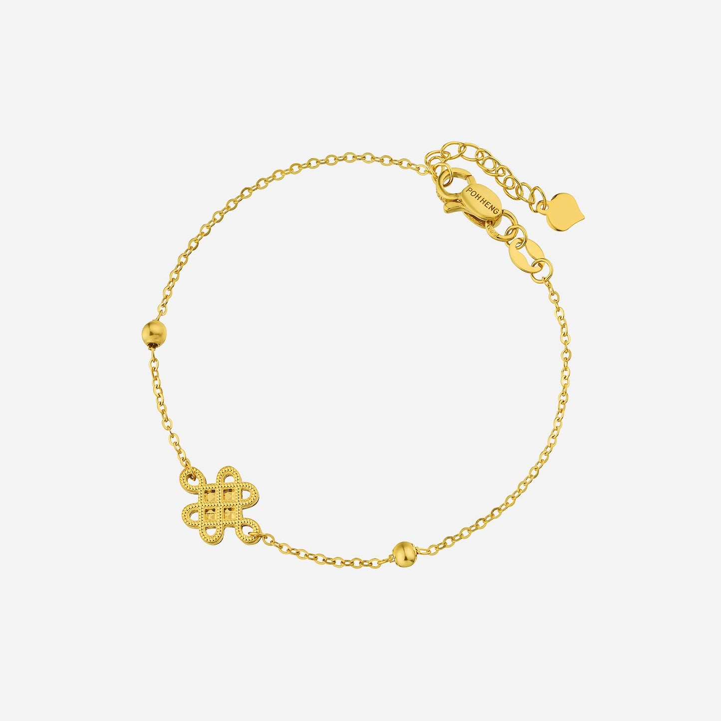 eternity knot bracelet in 22k yellow gold with textured gold beads and intricate knot design.