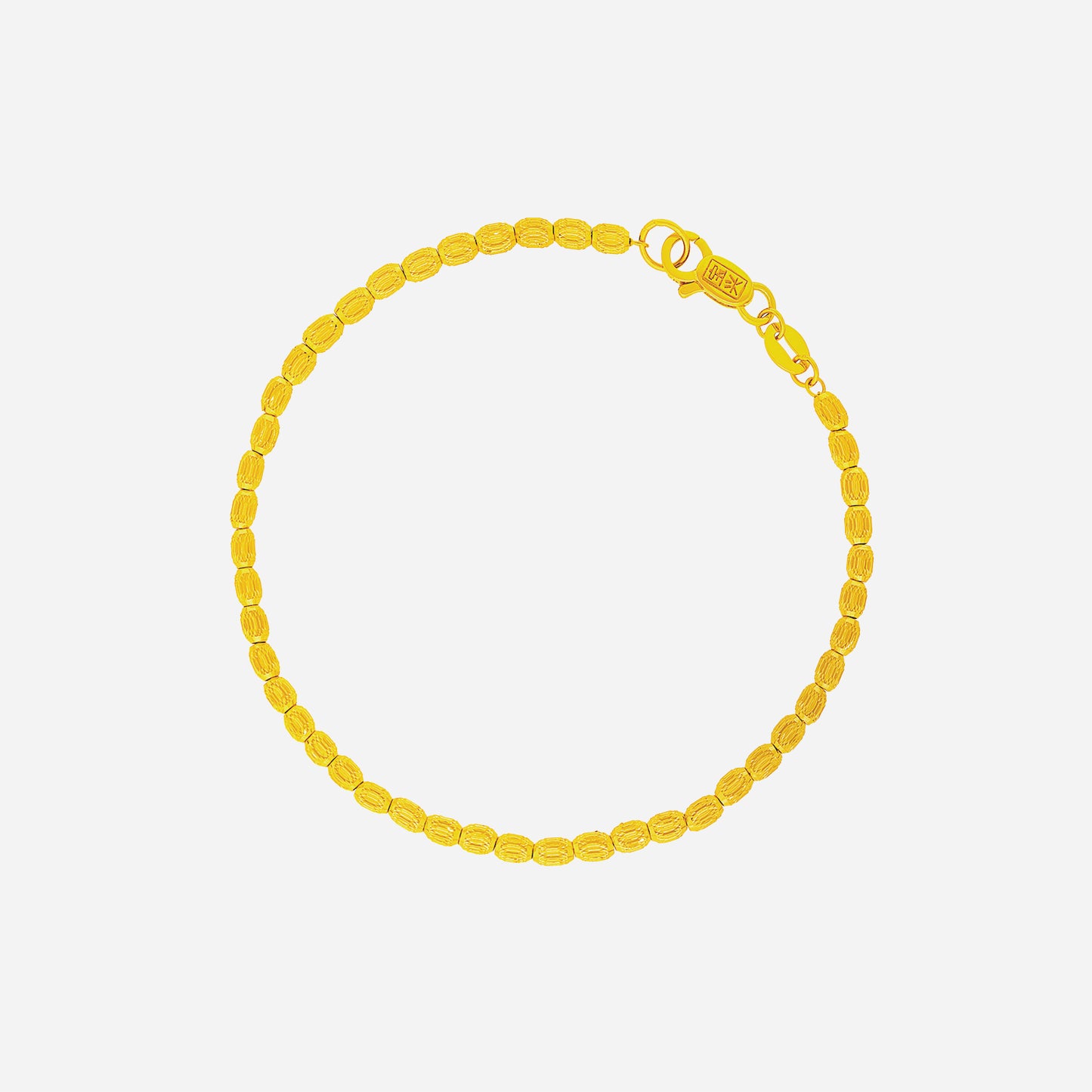 22k yellow gold beaded bracelet with a classic design and secure clasp, perfect for elegant wrist adornment.