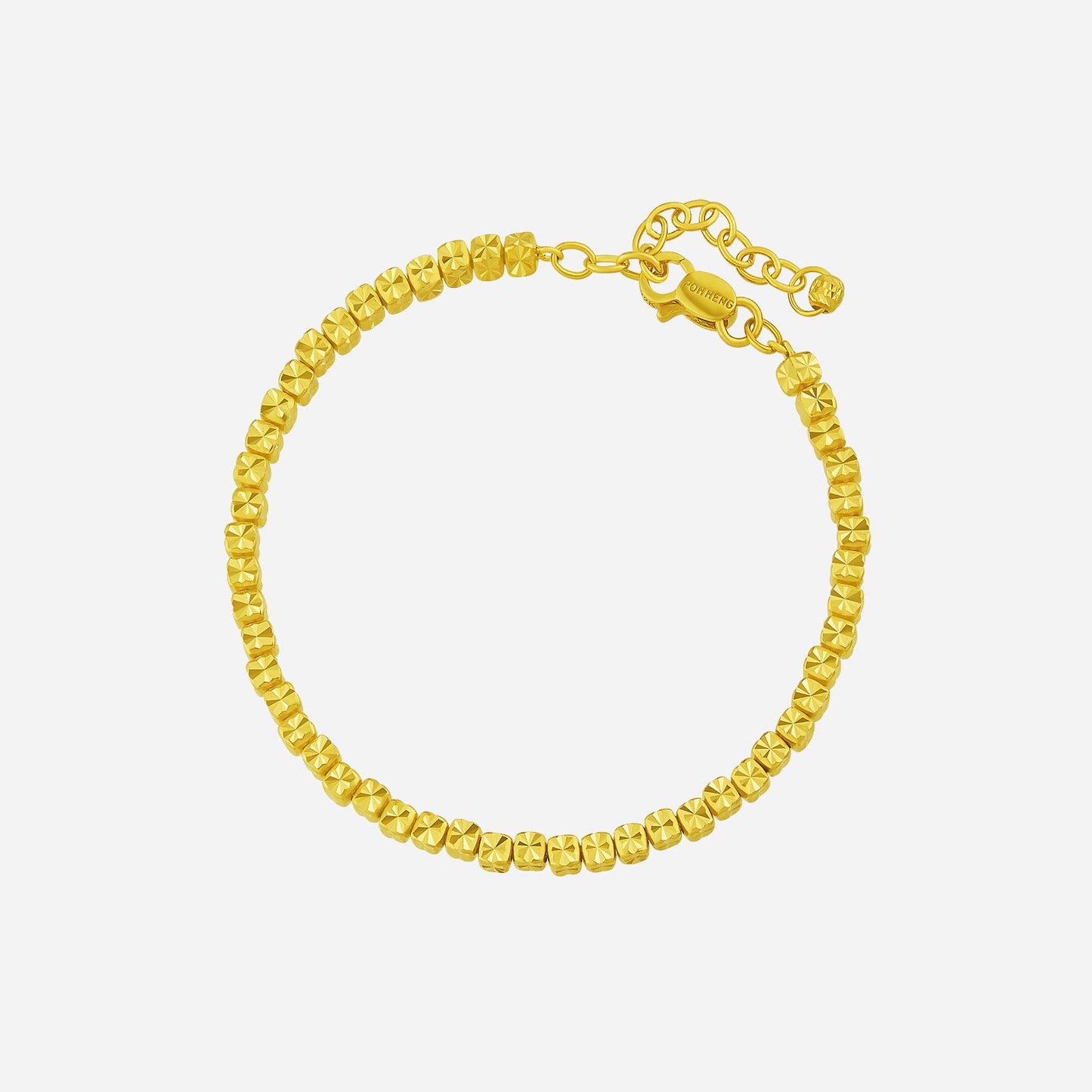 cube bead bracelet in 22k yellow gold with faceted beads, designed to catch light beautifully. perfect for daily wear.