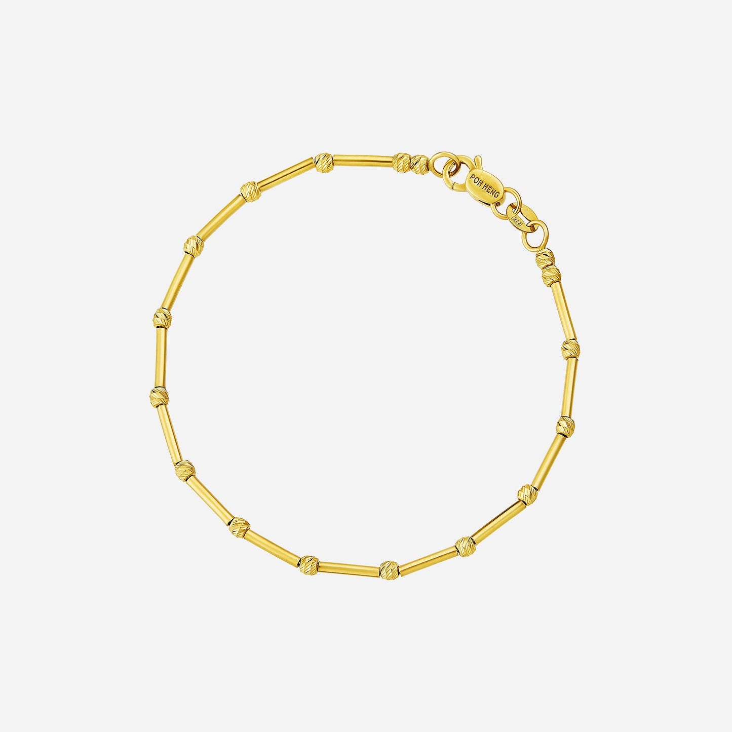 dainty tube link bracelet in 22k yellow gold with textured connectors, featuring slender tubular links.