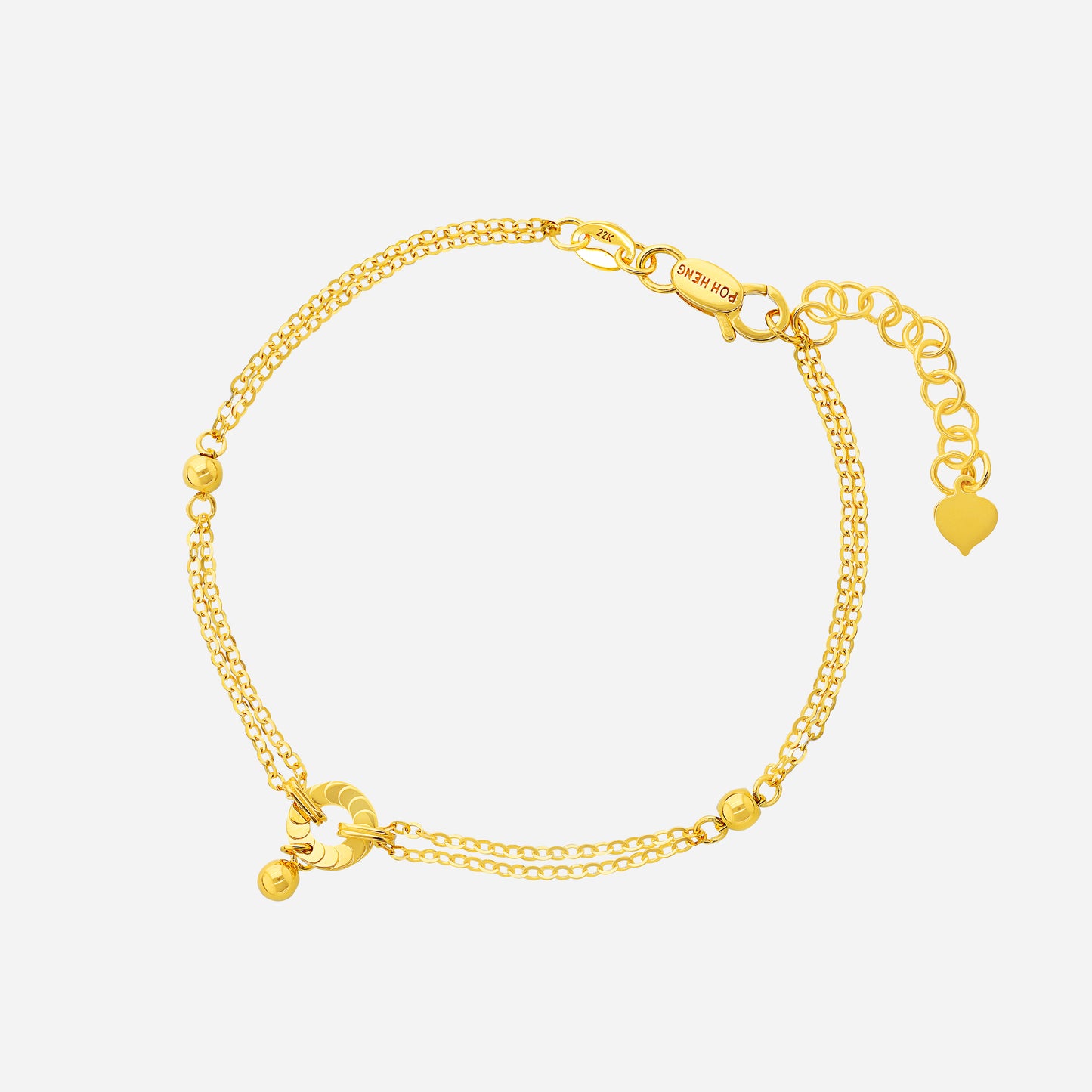 22k yellow gold connexus bracelet featuring a refined double-chain design and chic circular centerpiece.