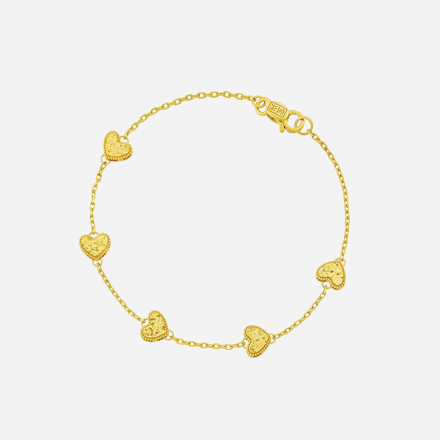 glimmering heart bracelet in radiant 22k yellow gold with five textured hearts on a fine chain.