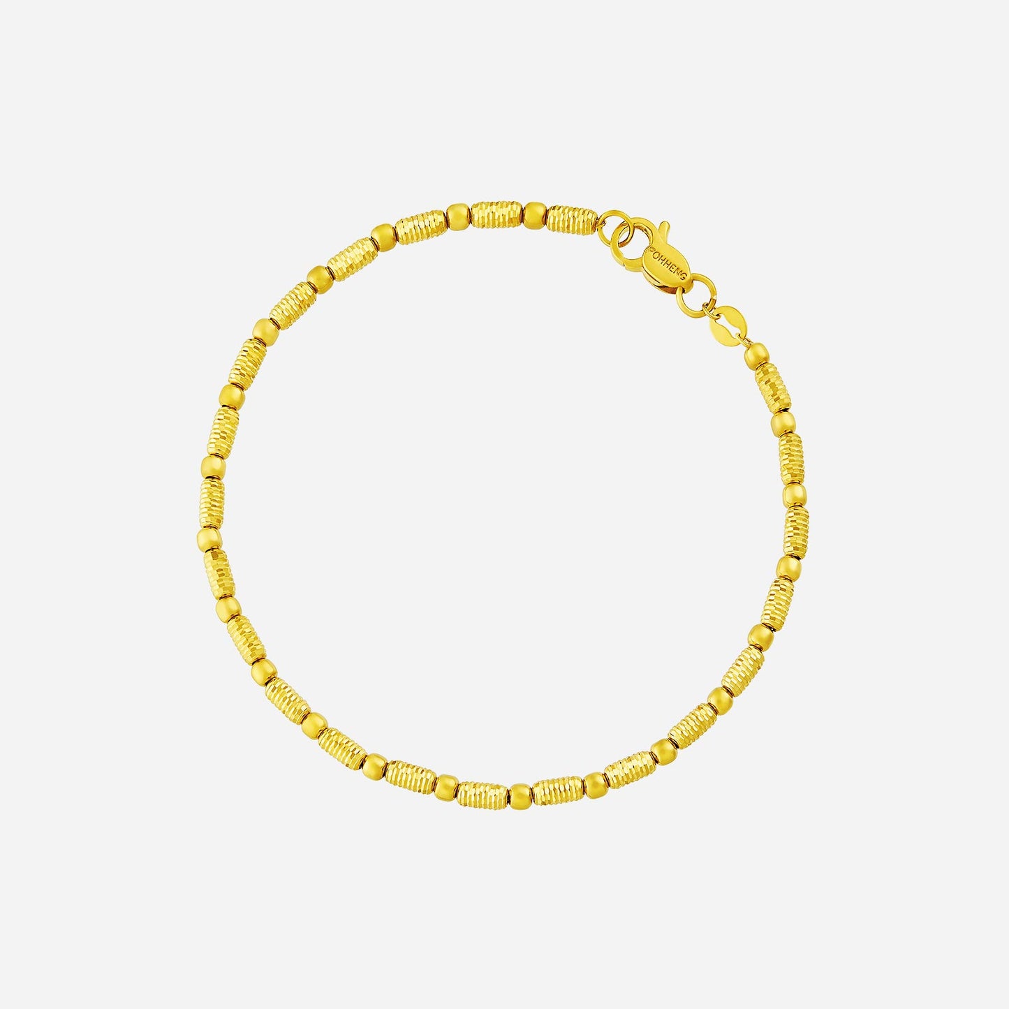 harmonic beaded bracelet in 22k yellow gold with alternating rounded and faceted barrel-shaped beads.
