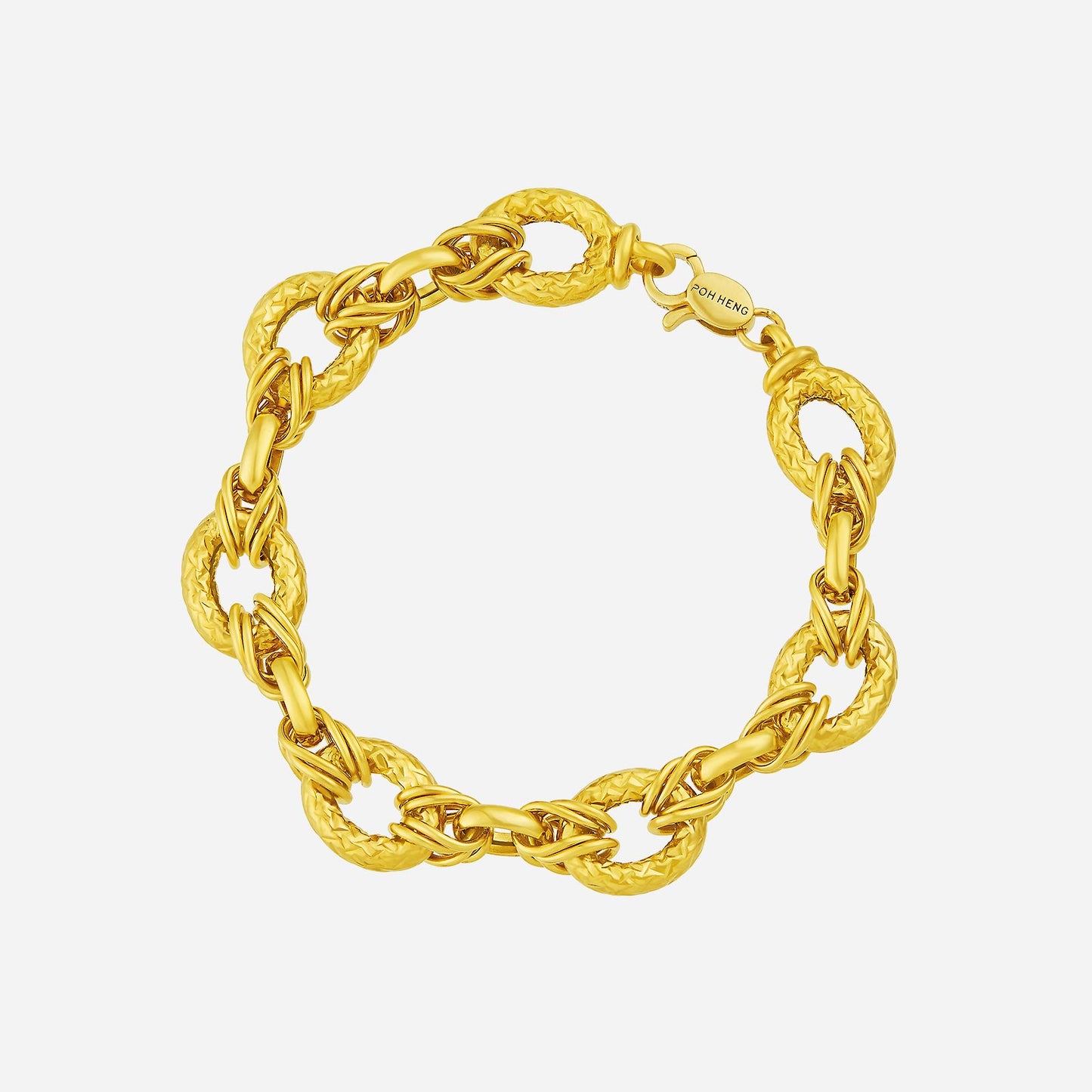 linked loop bracelet in 22k yellow gold with textured oval links, showcasing an elegant and bold design.