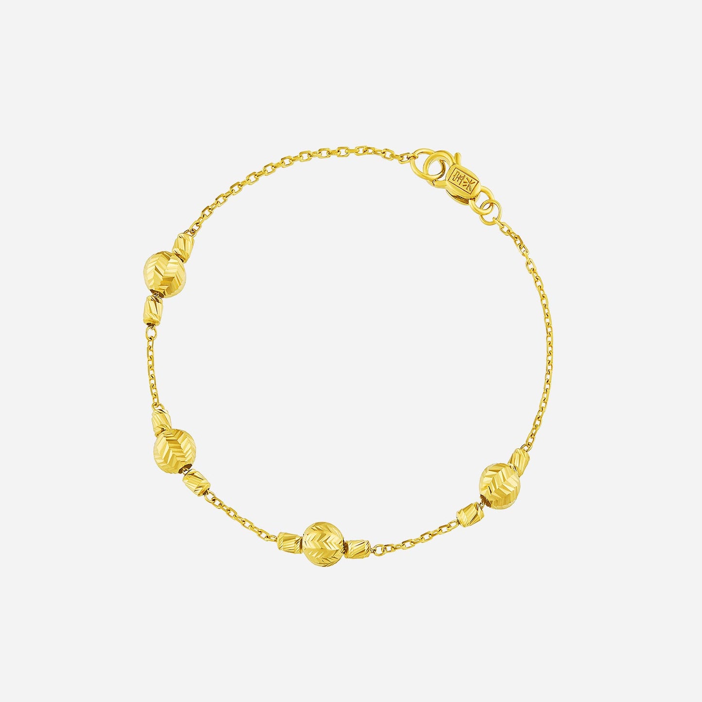 velvety beaded bracelet in 22k yellow gold with polished and matte beads for a radiant finish.